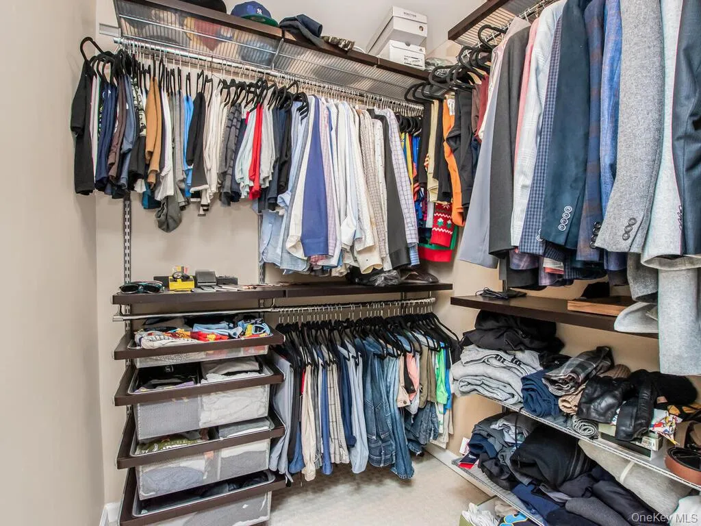 Spacious walk in custom closet Spacious walk in custom closet