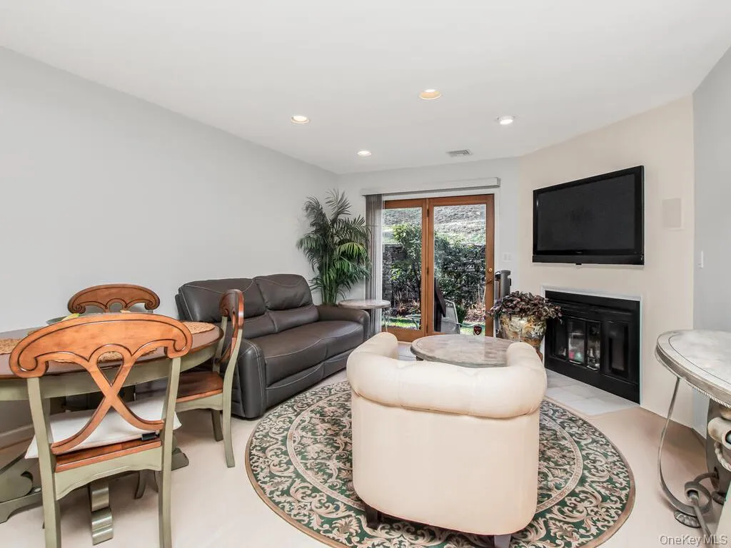 Living area featuring a fireplace and recessed lighting Living area featuring a fireplace and recessed lighting