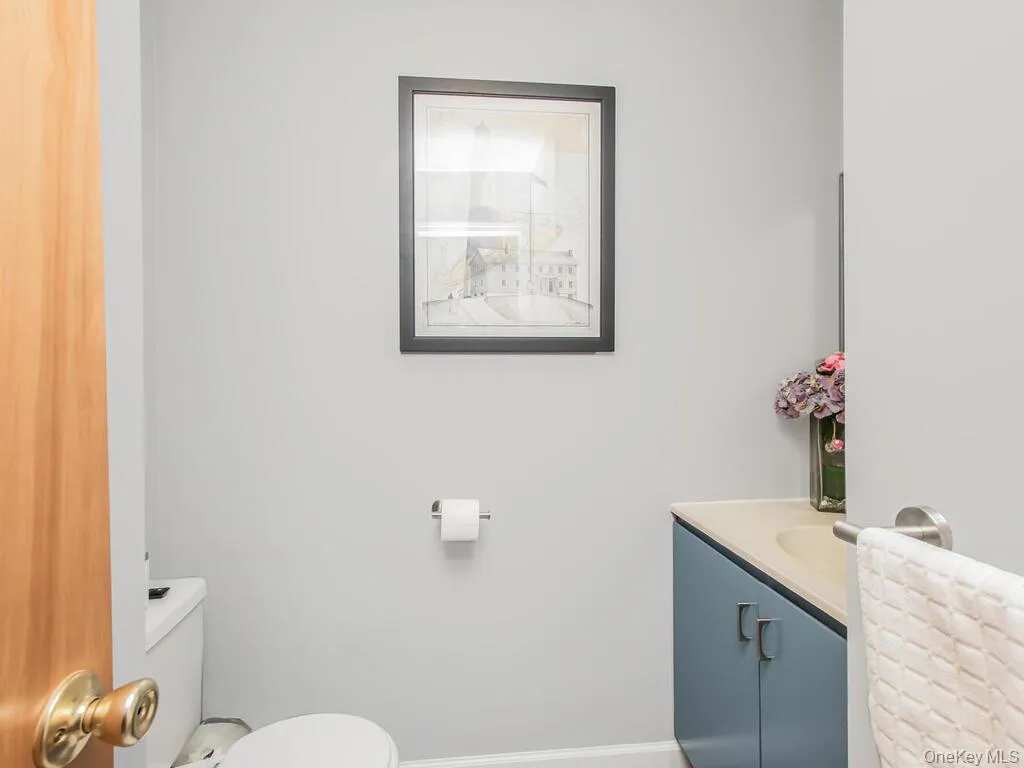 Bathroom featuring vanity and toilet Bathroom featuring vanity and toilet