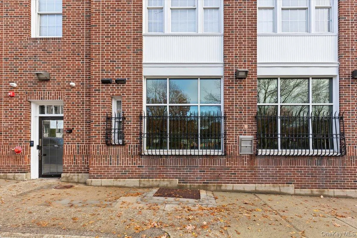 Property entrance featuring brick siding Property entrance featuring brick siding