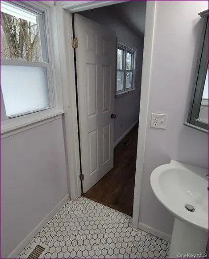 Bathroom featuring baseboards Bathroom featuring baseboards