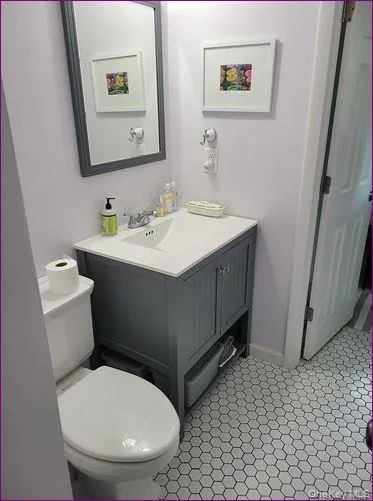 Bathroom featuring vanity and toilet Bathroom featuring vanity and toilet