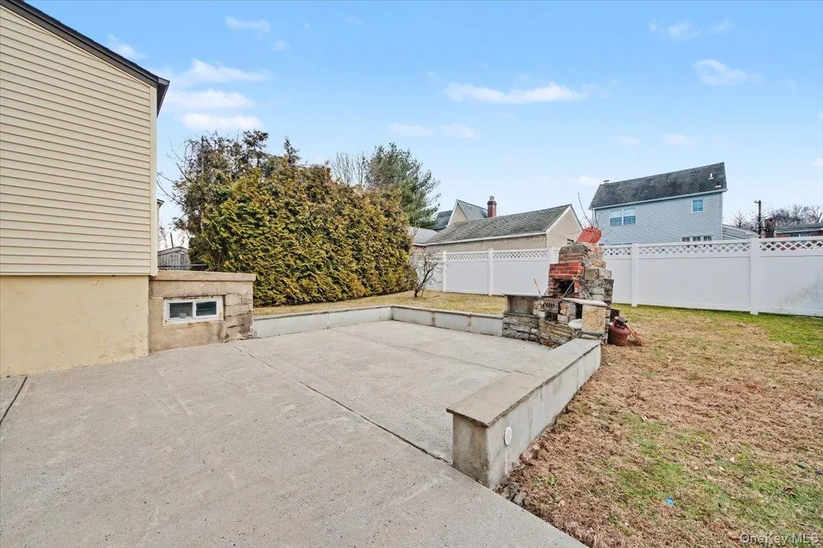 Fenced backyard with a patio Fenced backyard with a patio