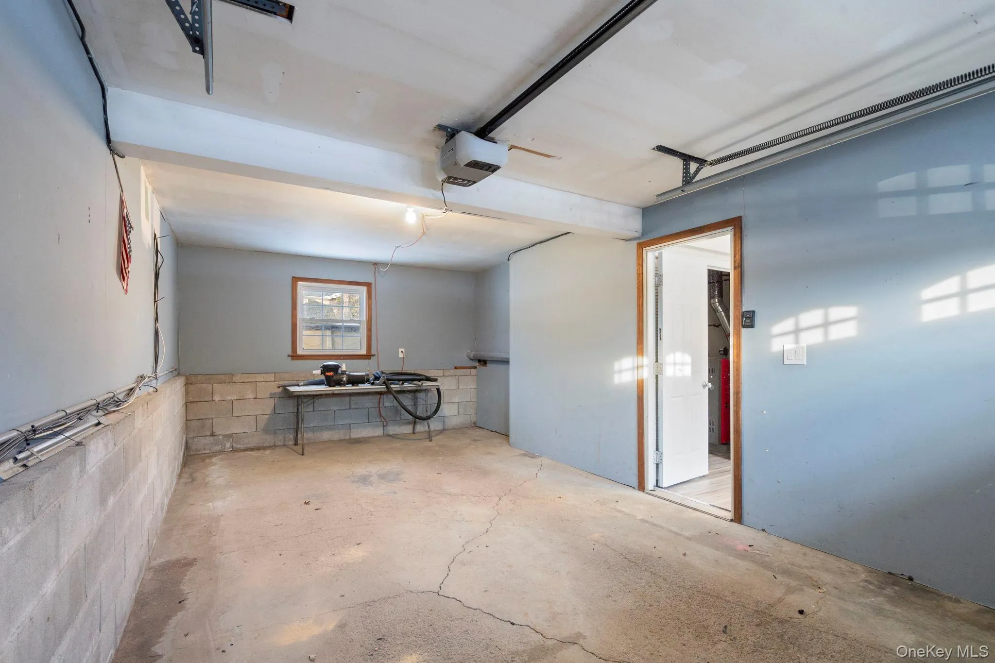 Garage with concrete block wall and a garage door opener Garage with concrete block wall and a garage door opener