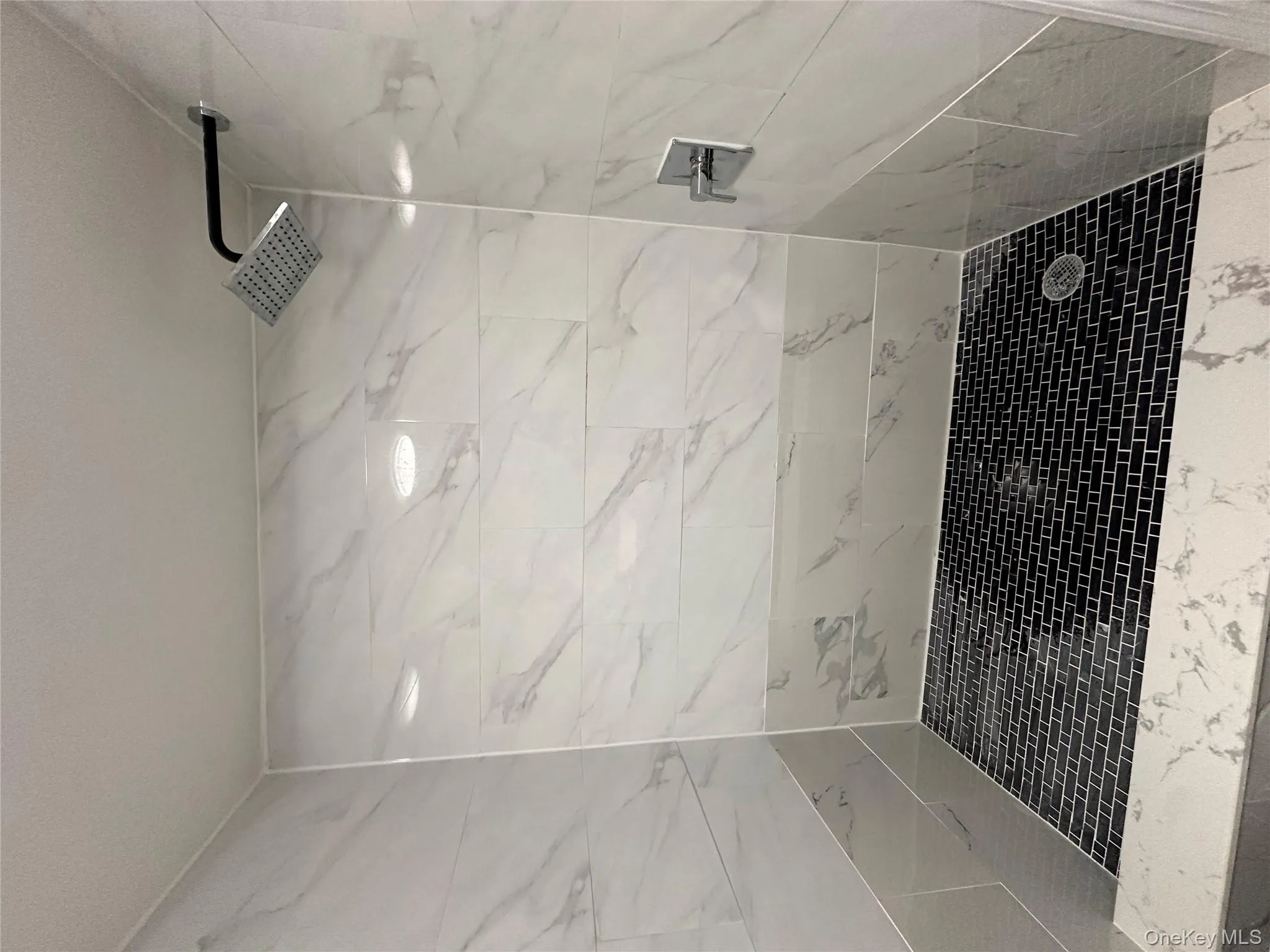 Full bathroom with a shower stall Full bathroom with a shower stall