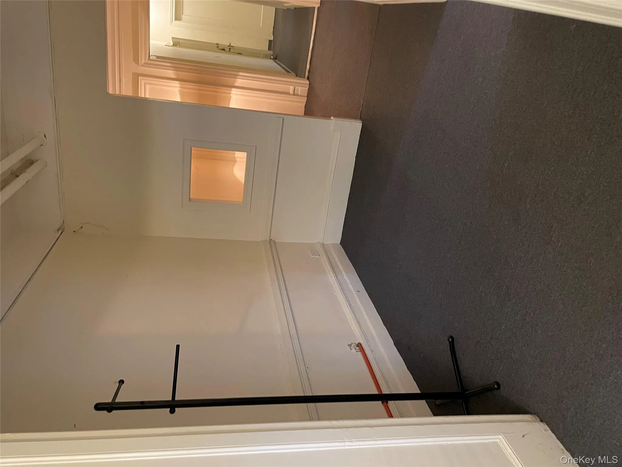 Unfurnished room with dark carpet Unfurnished room with dark carpet