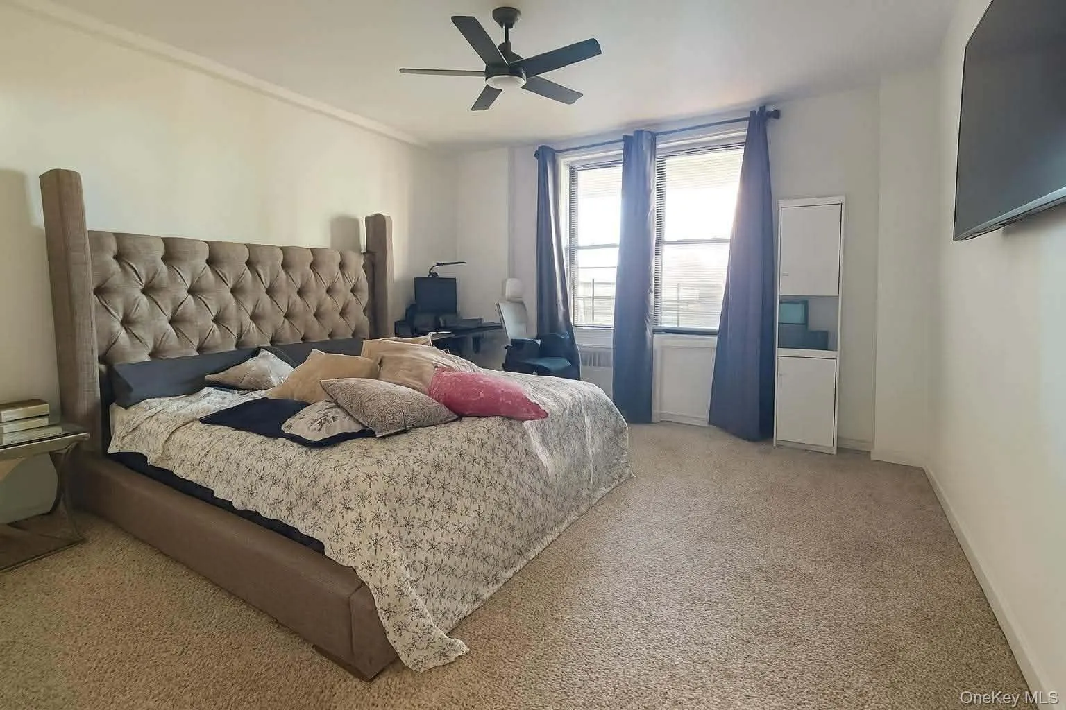Bedroom with light carpet and ceiling fan Bedroom with light carpet and ceiling fan