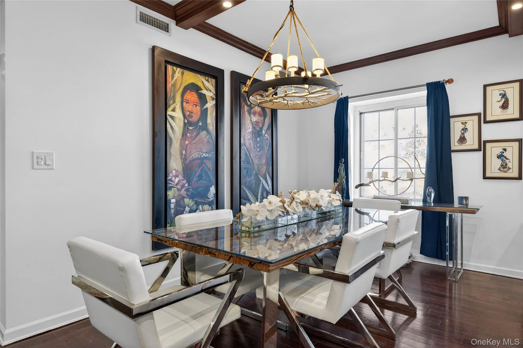Dining room with a chandelier, dark wood-type flooring, and crown molding Dining room with a chandelier, dark wood-type flooring, and crown molding