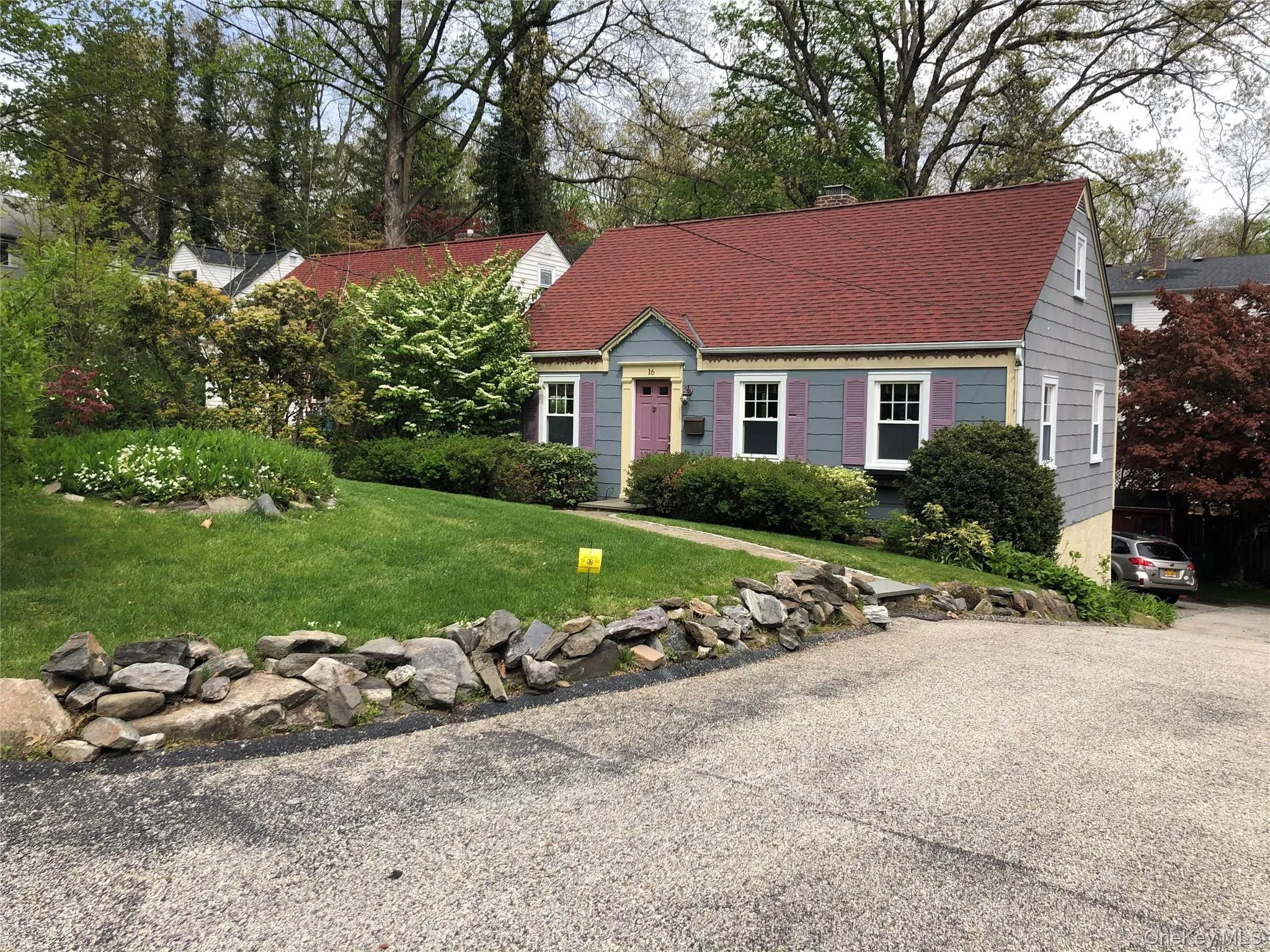 View of front of home with a chimney, a front yard, and roof with shingles View of front of home with a chimney, a front yard, and roof with shingles