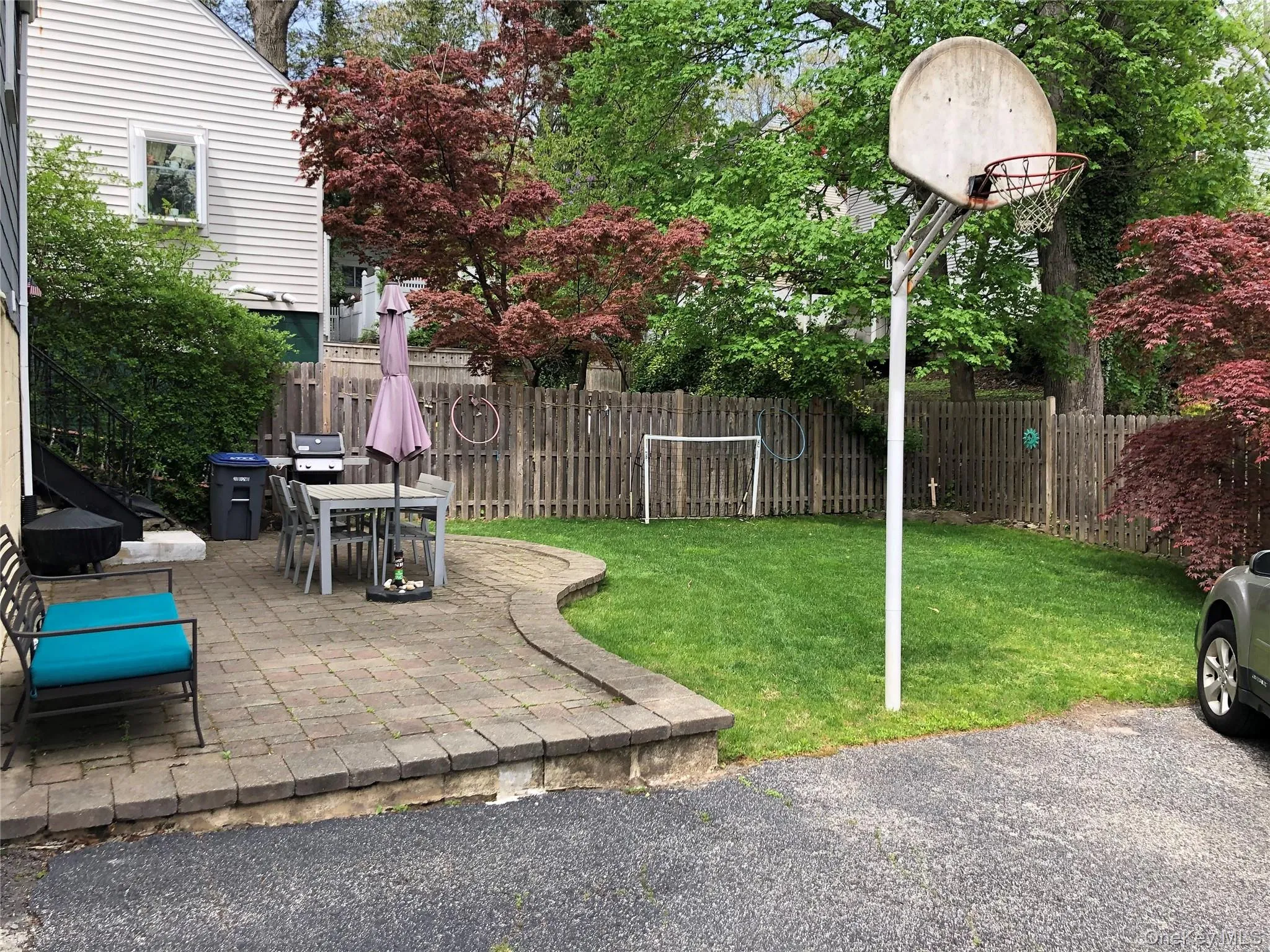 Fenced backyard featuring a patio area Fenced backyard featuring a patio area