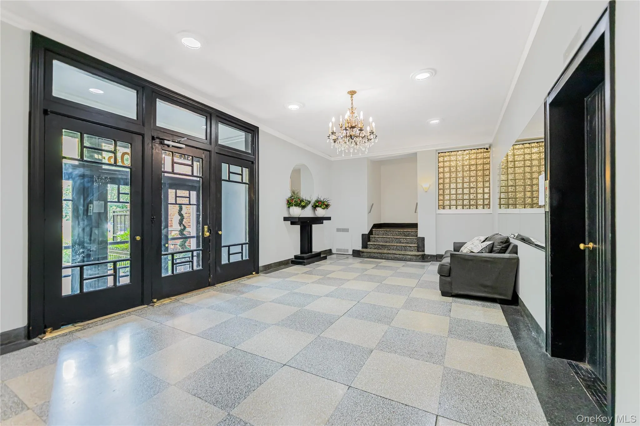 Common area with crown molding, stairs, and recessed lighting Common area with crown molding, stairs, and recessed lighting