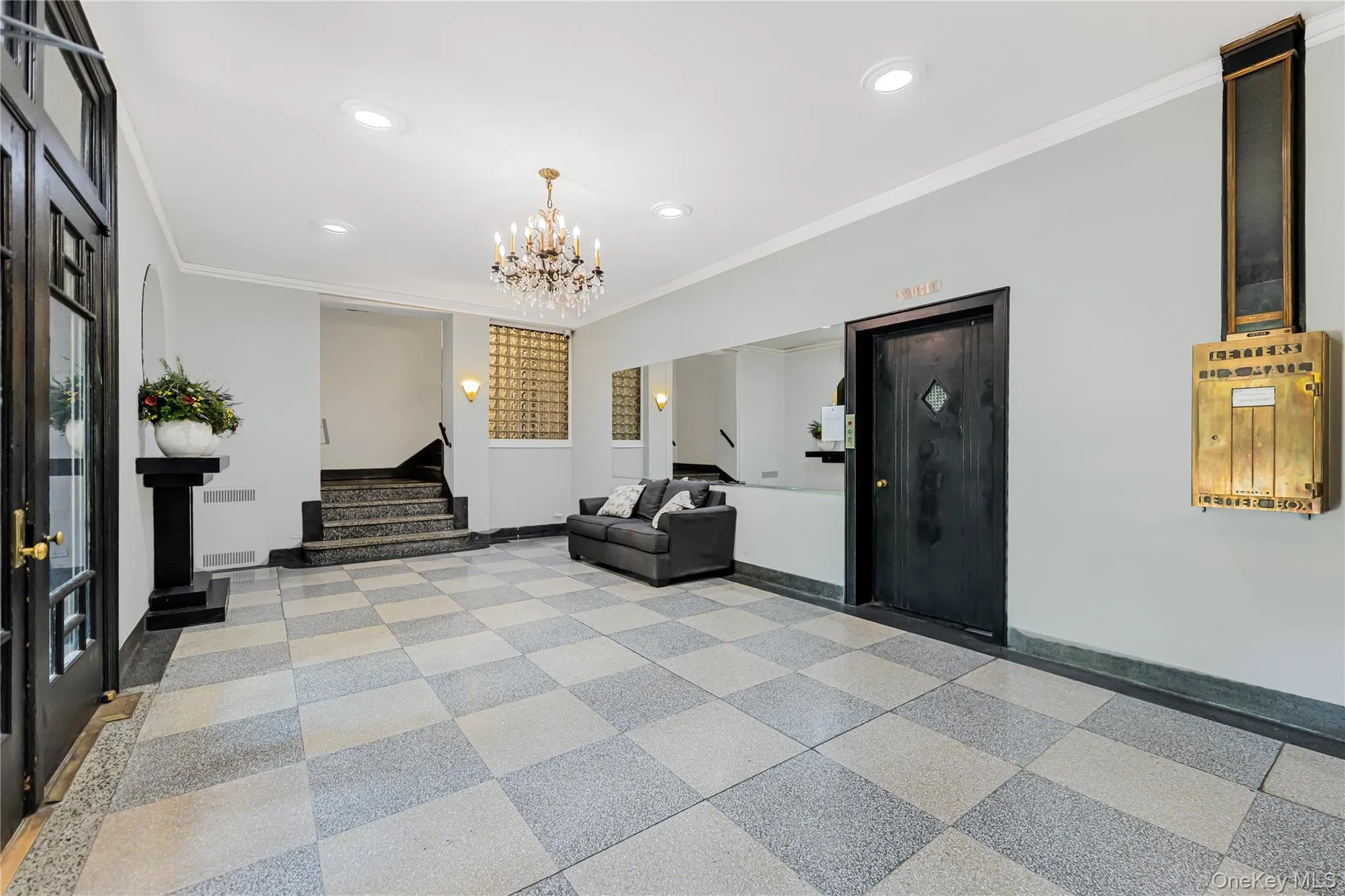 Lobby featuring crown molding, stairs, and recessed lighting Lobby featuring crown molding, stairs, and recessed lighting
