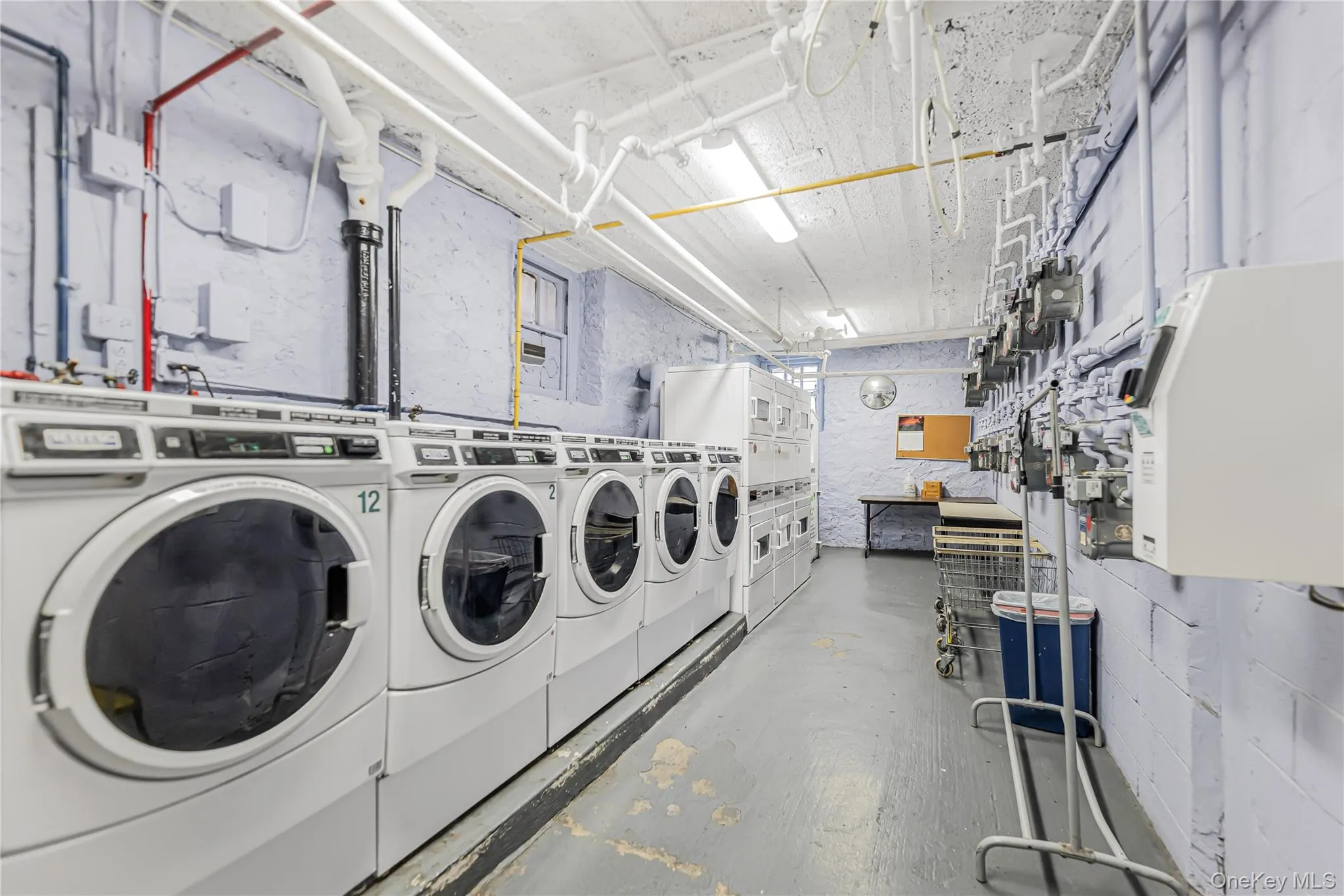 Community laundry featuring washer and clothes dryer Community laundry featuring washer and clothes dryer