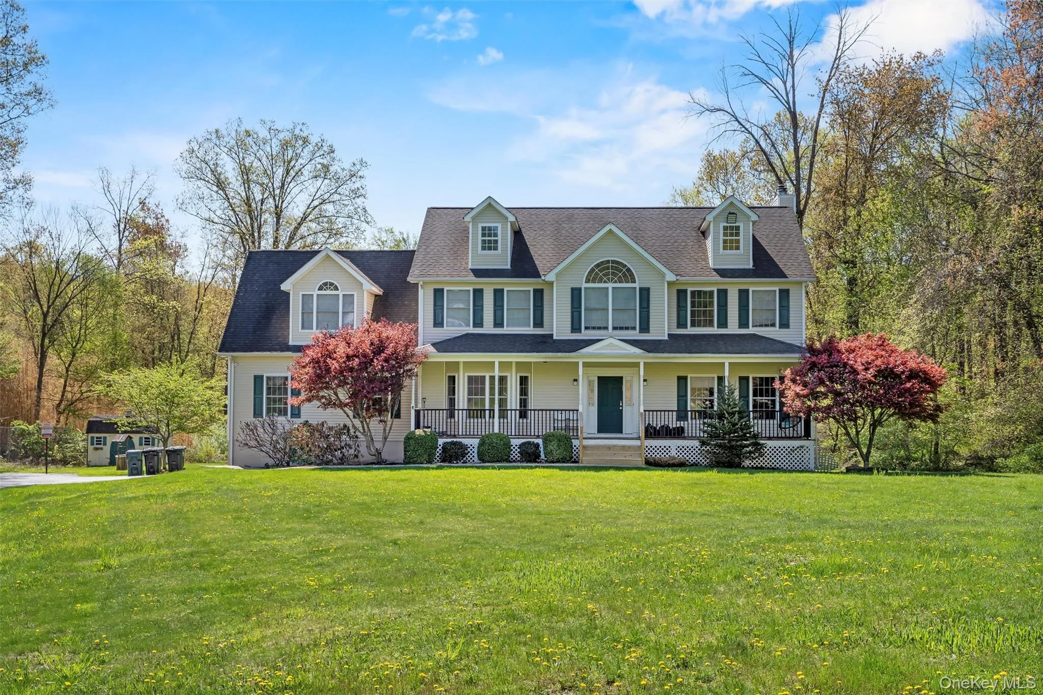 View of front of property with a porch and a front lawn View of front of property with a porch and a front lawn