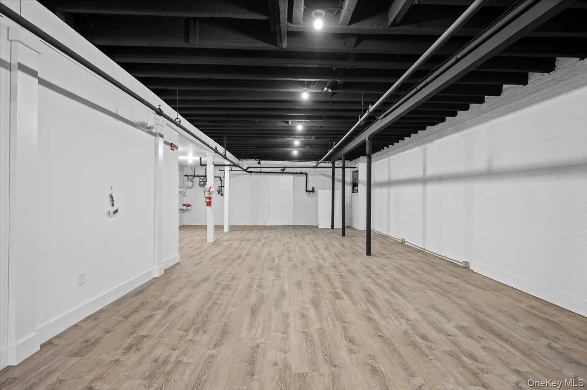 Finished basement featuring light wood-style floors Finished basement featuring light wood-style floors