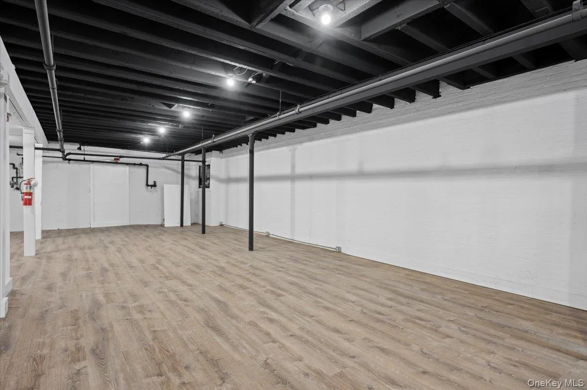 Finished basement with light wood-type flooring Finished basement with light wood-type flooring