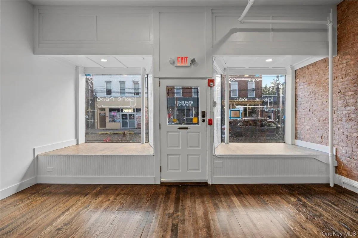Entrance foyer featuring dark wood-style floors Entrance foyer featuring dark wood-style floors