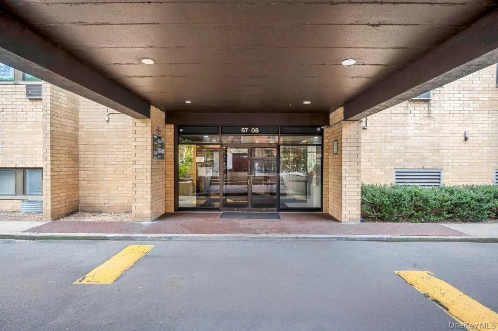 Property entrance with brick siding Property entrance with brick siding