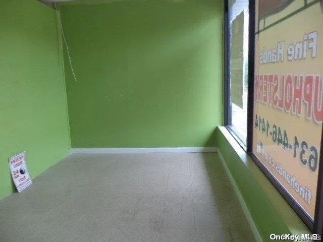 Unfurnished room featuring tile patterned floors Unfurnished room featuring tile patterned floors