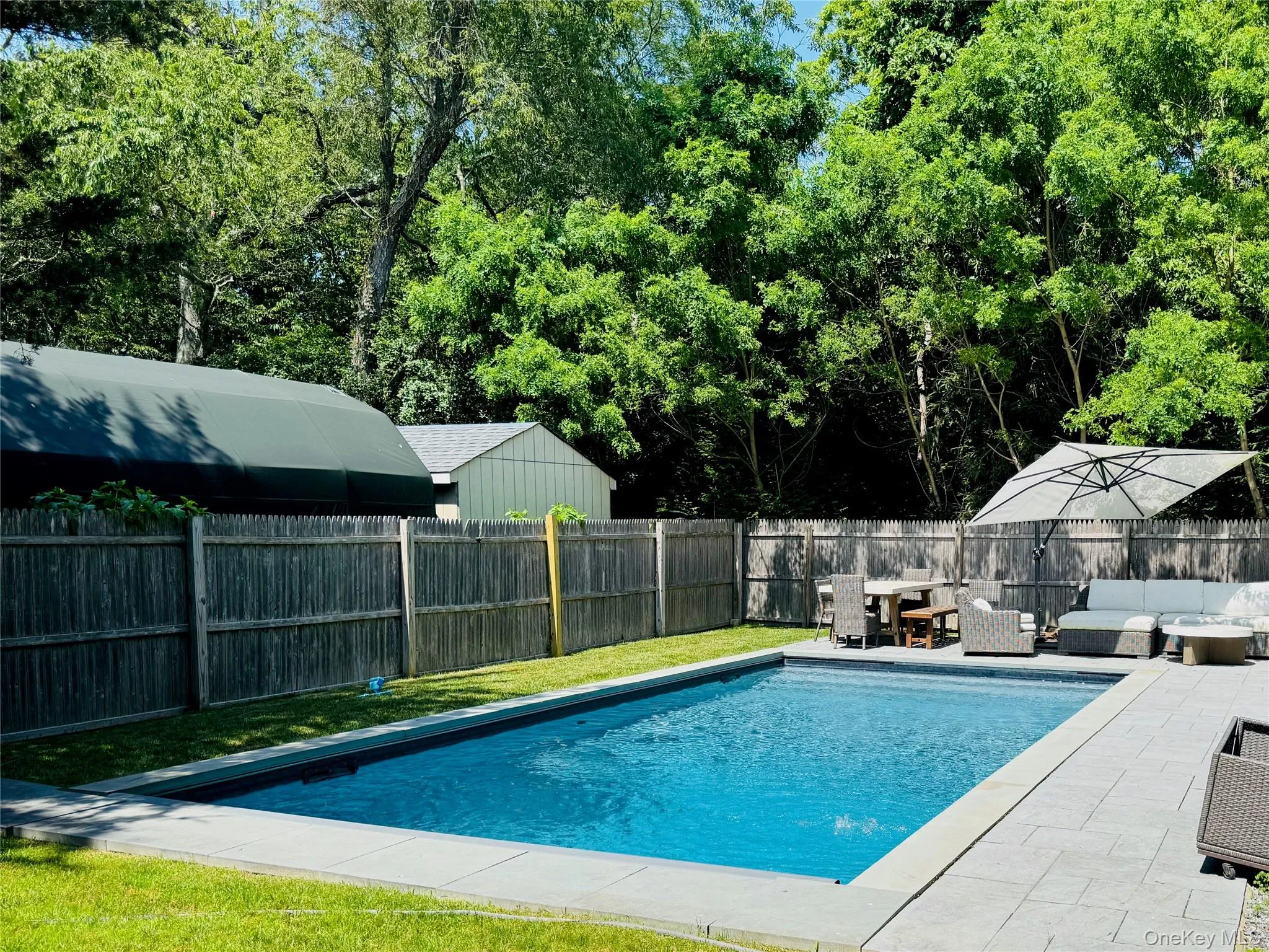 View of swimming pool featuring outdoor lounge area, a fenced backyard, and a patio View of swimming pool featuring outdoor lounge area, a fenced backyard, and a patio