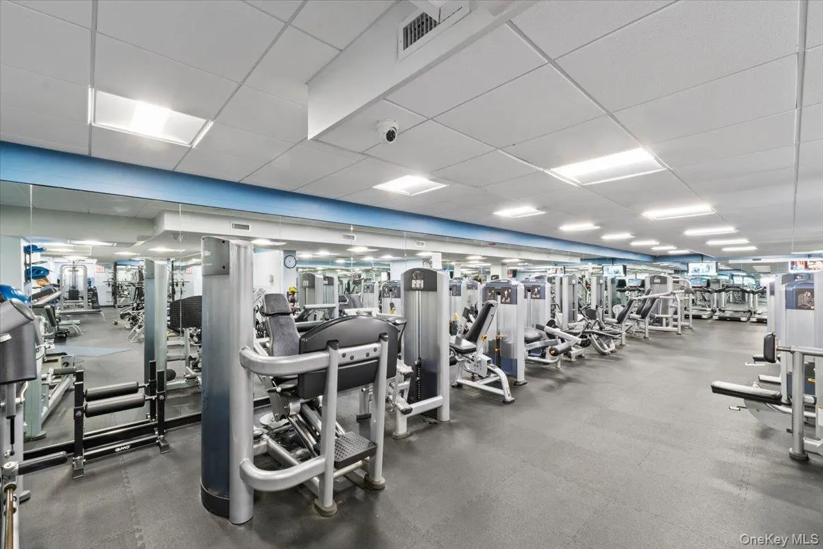 Workout area with a paneled ceiling Workout area with a paneled ceiling