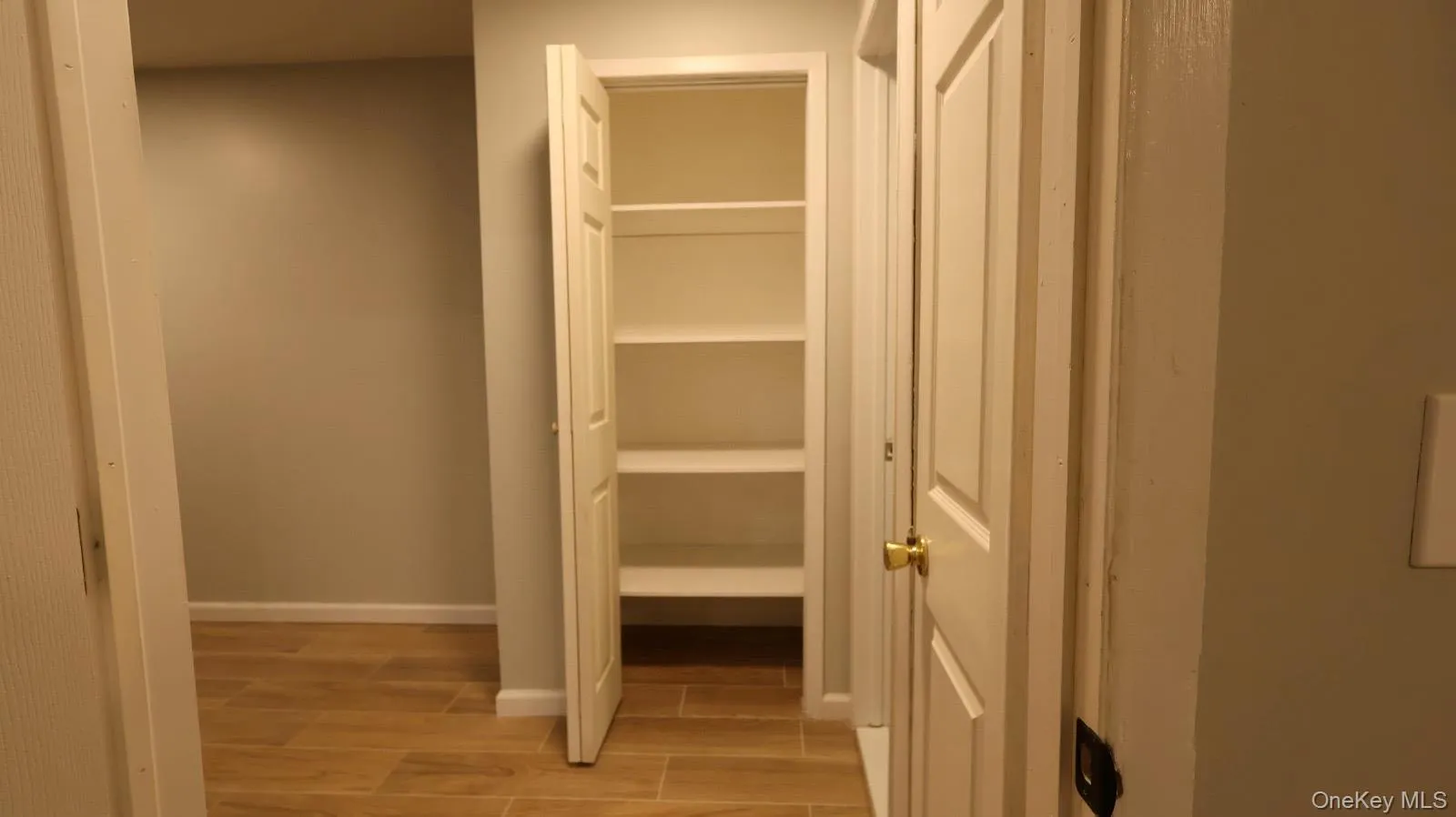 Linen closet for convenient storage of towels, toiletries, and essentials. Linen closet for convenient storage of towels, toiletries, and essentials.