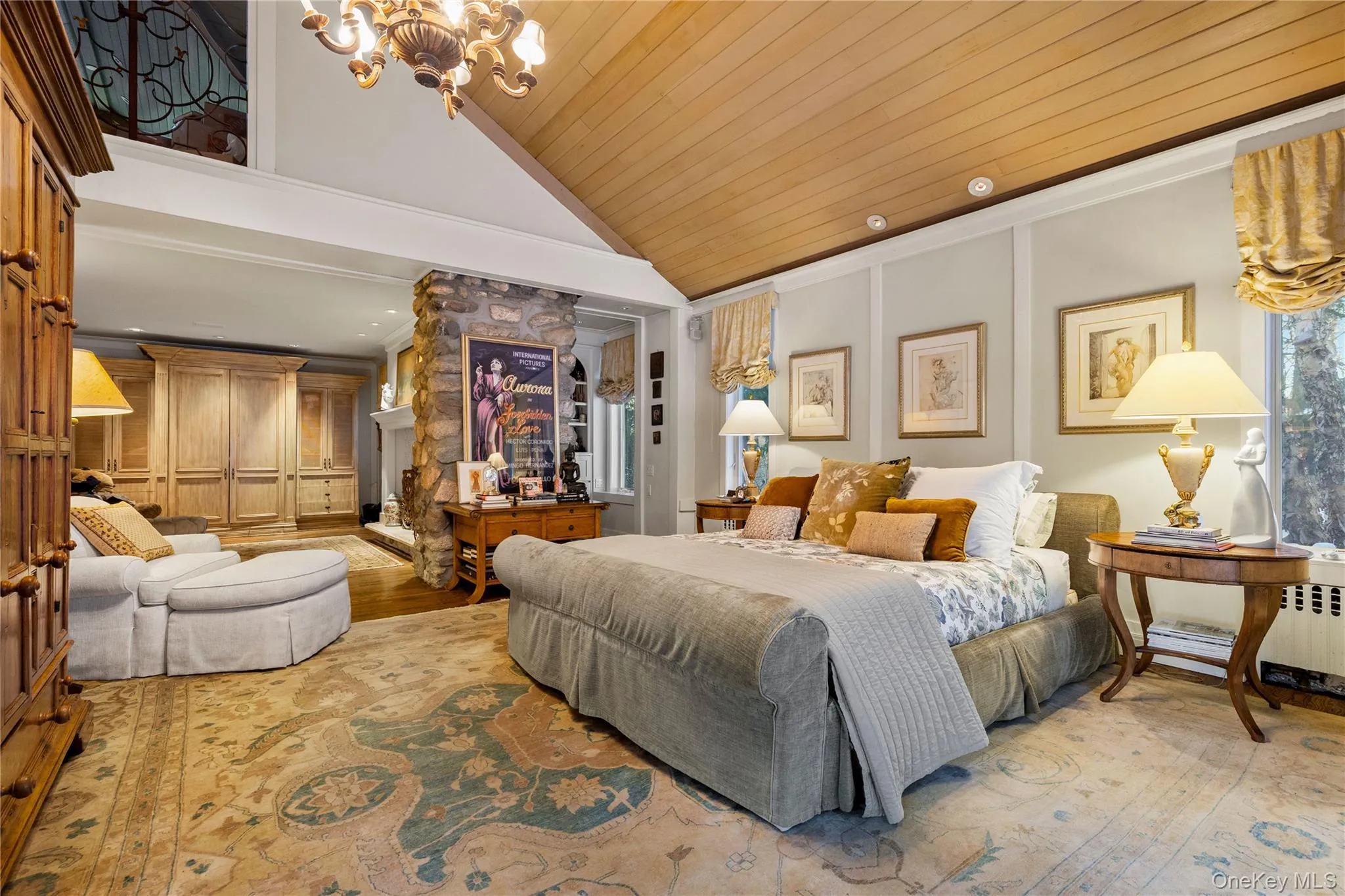 The primary suite is on the main level with a wood burning fireplace and doors to the pool and spa. The primary suite is on the main level with a wood burning fireplace and doors to the pool and spa.