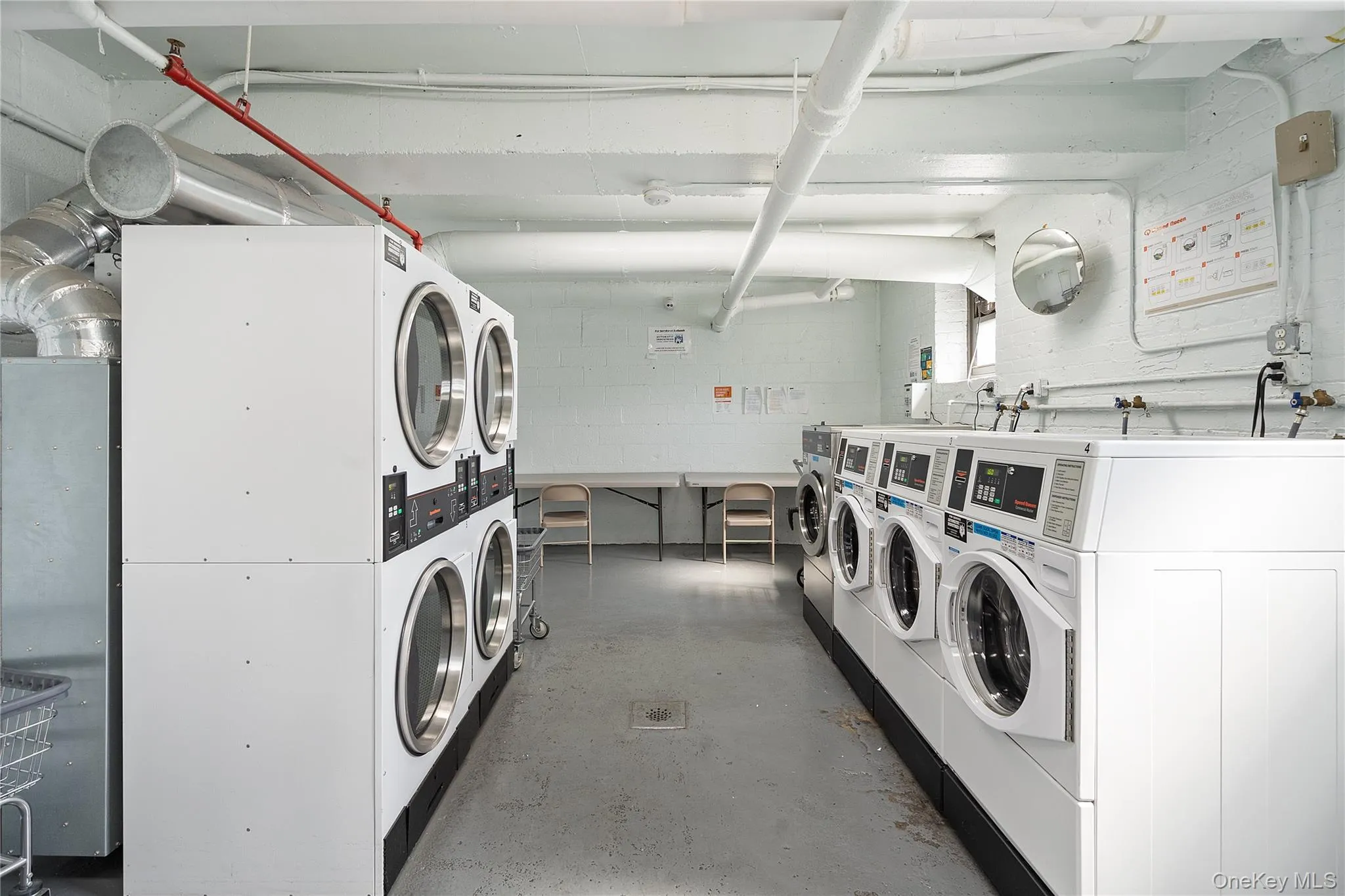 Shared laundry with washing machine and clothes dryer and stacked washing machine and dryer Shared laundry with washing machine and clothes dryer and stacked washing machine and dryer