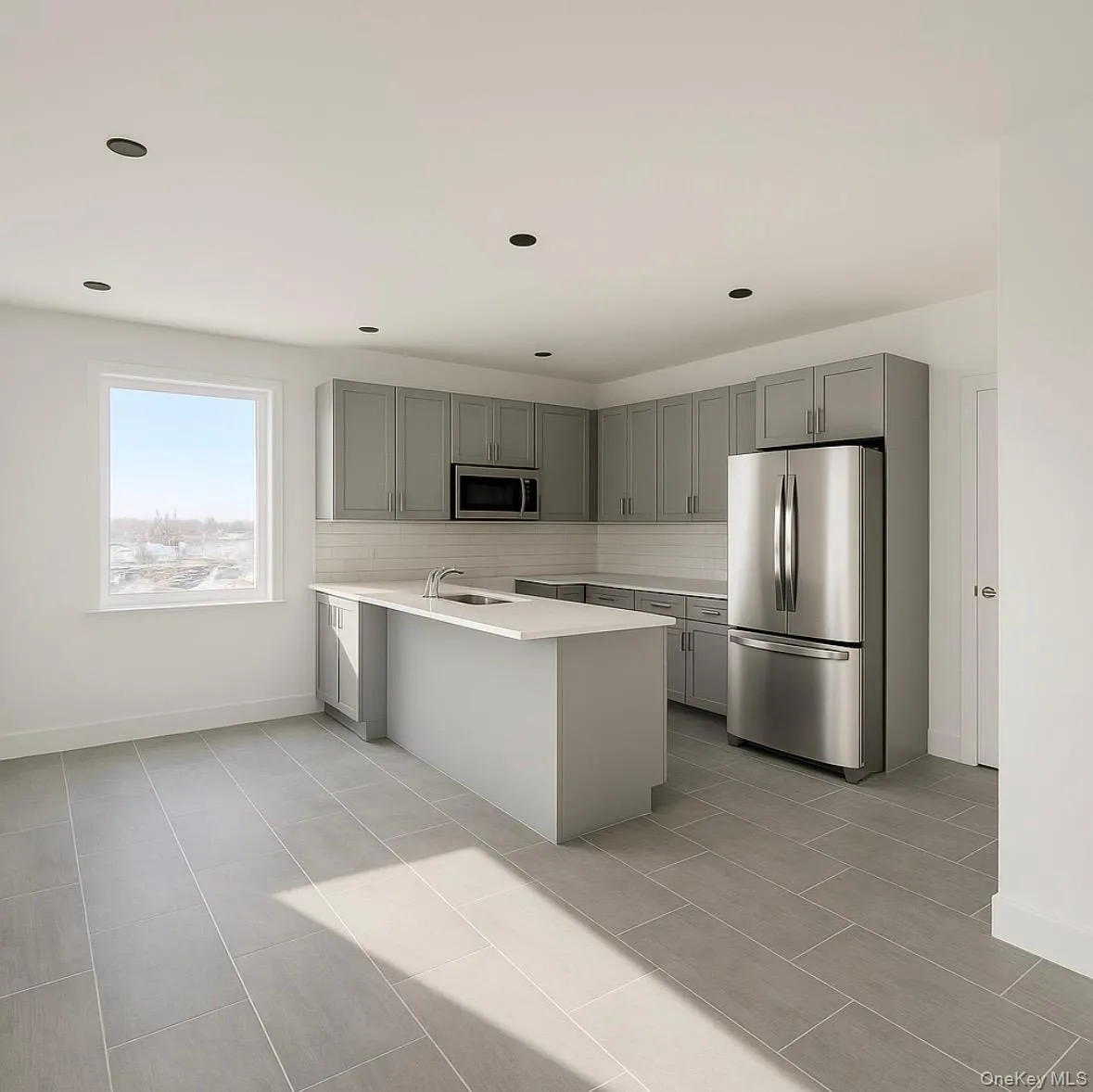 Kitchen featuring gray cabinetry, appliances with stainless steel finishes, a peninsula, decorative backsplash, and light tile patterned floors Kitchen featuring gray cabinetry, appliances with stainless steel finishes, a peninsula, decorative backsplash, and light tile patterned floors