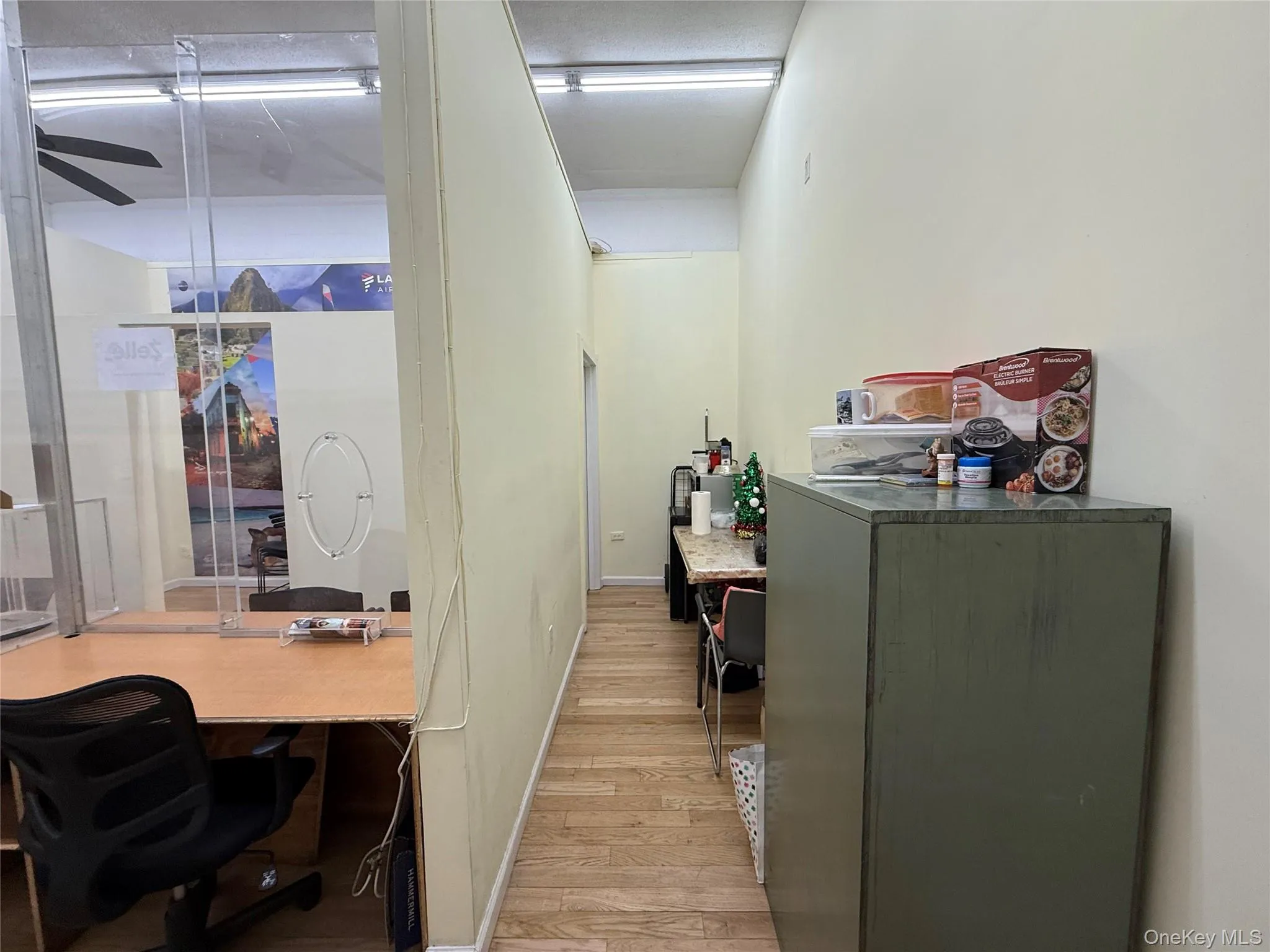Office with light wood-type flooring and ceiling fan Office with light wood-type flooring and ceiling fan