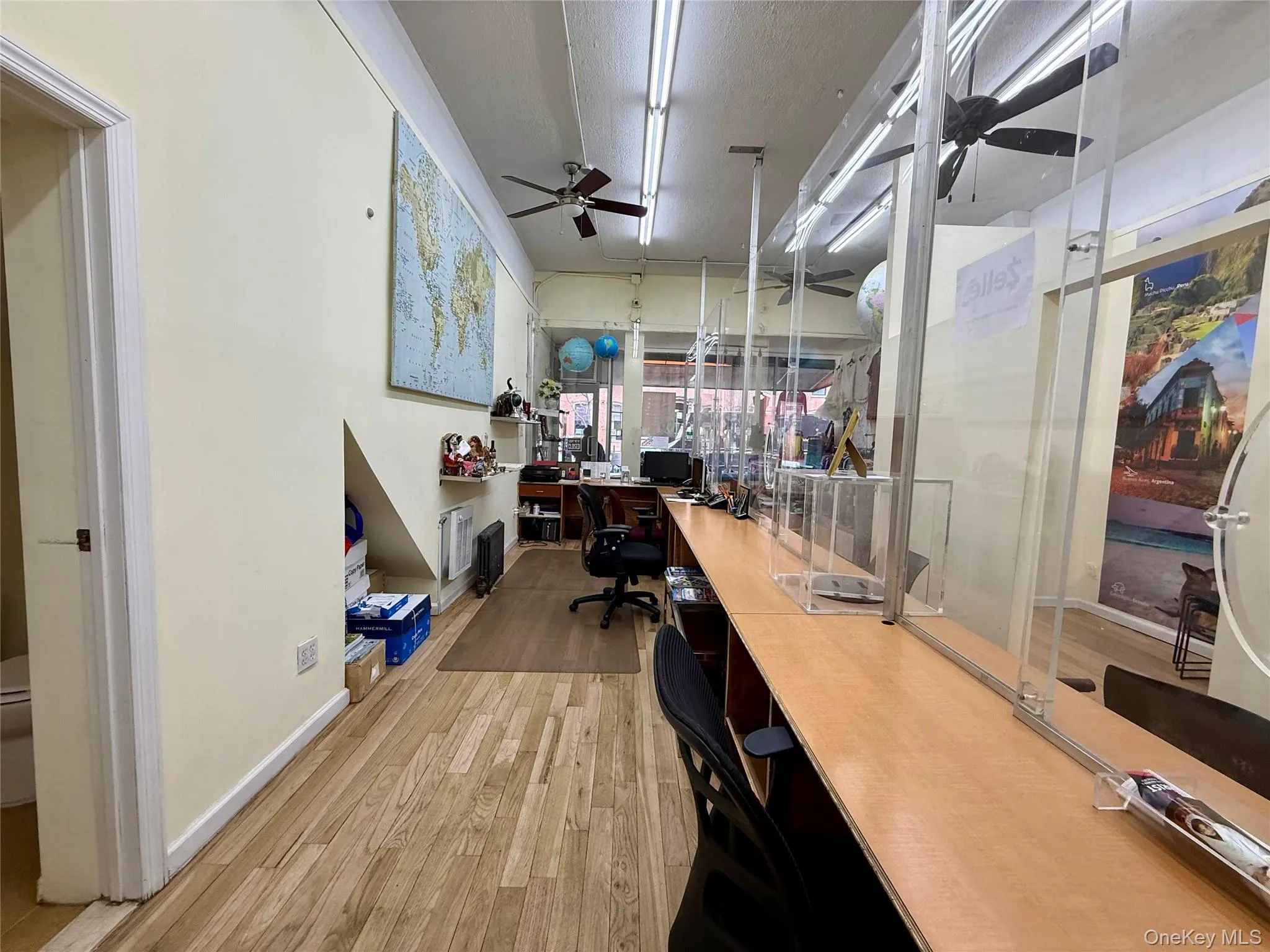 Office featuring ceiling fan and a textured ceiling Office featuring ceiling fan and a textured ceiling