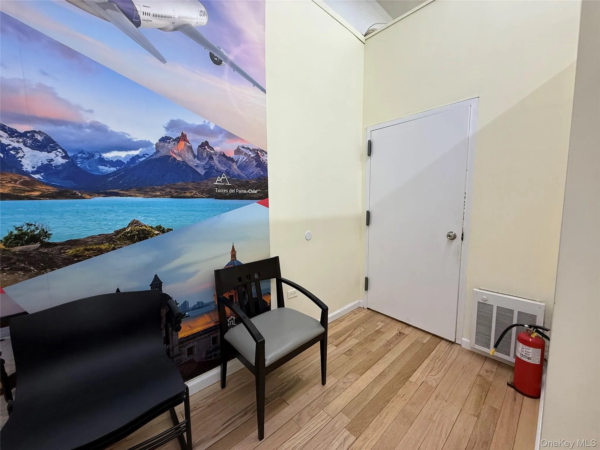 Sitting room featuring light wood-style floors and a mountain view Sitting room featuring light wood-style floors and a mountain view