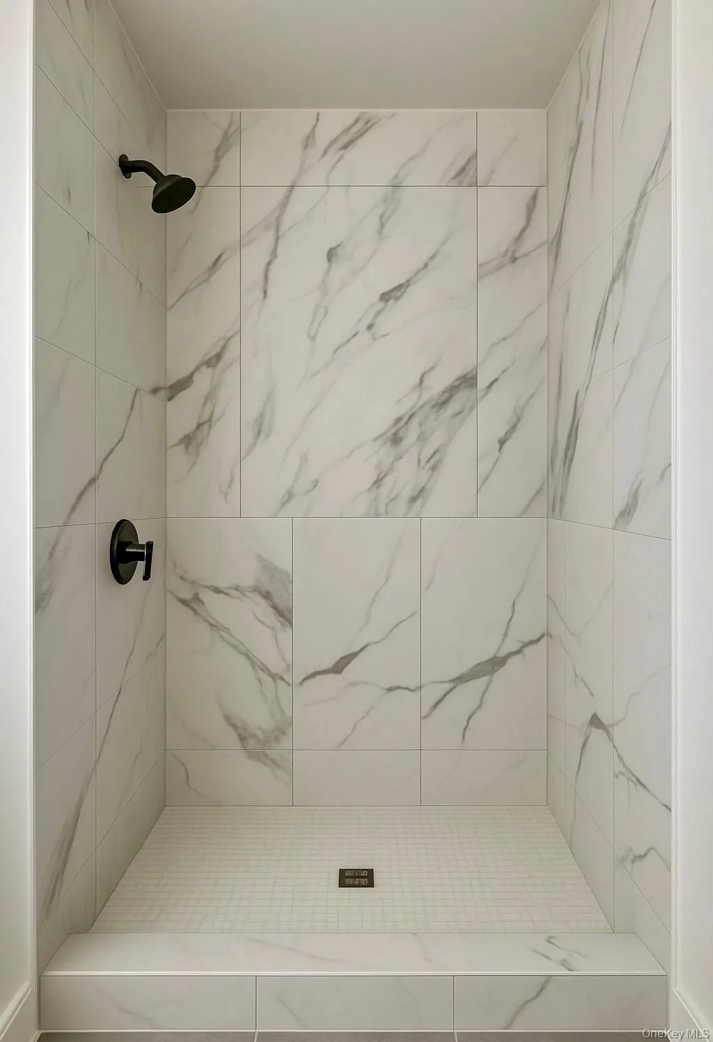 Full bath with a marble finish shower Full bath with a marble finish shower