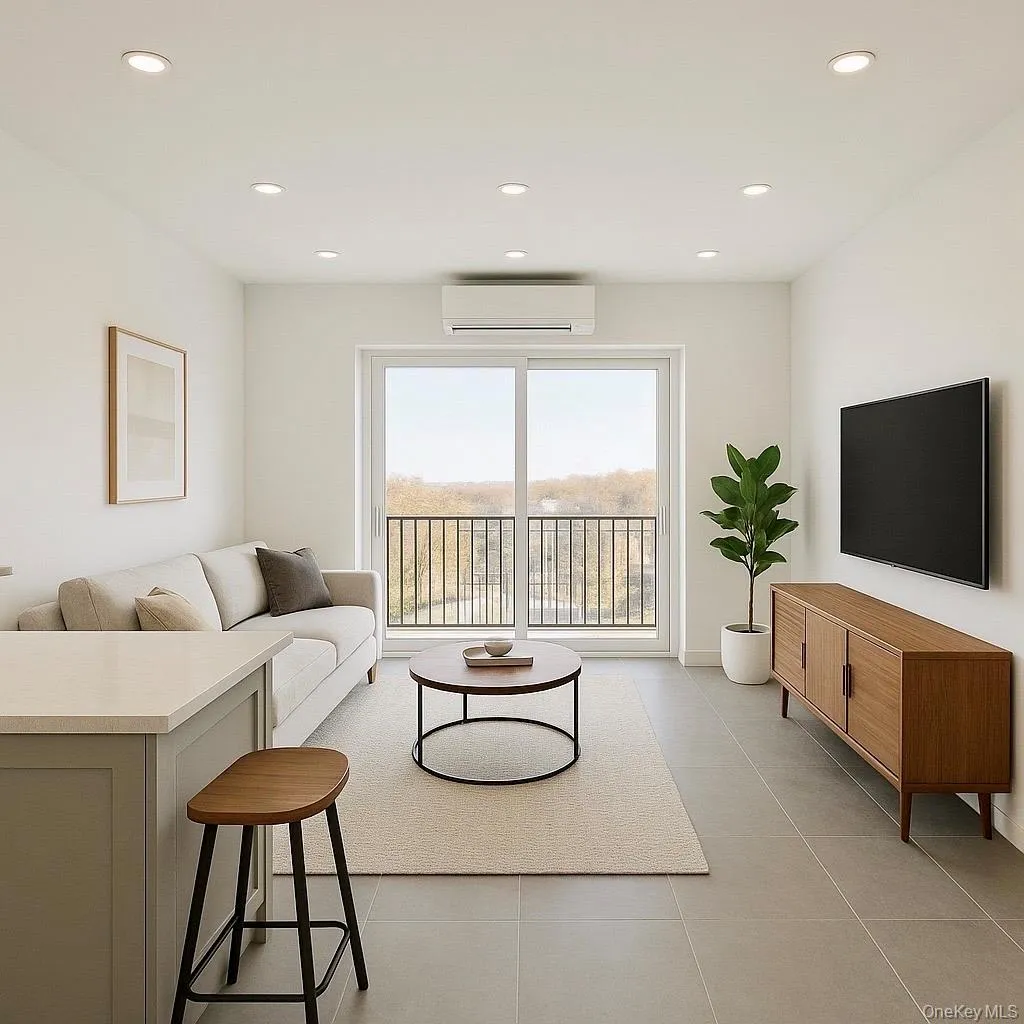 Living room with a wall unit AC, recessed lighting, and light tile patterned floors Living room with a wall unit AC, recessed lighting, and light tile patterned floors
