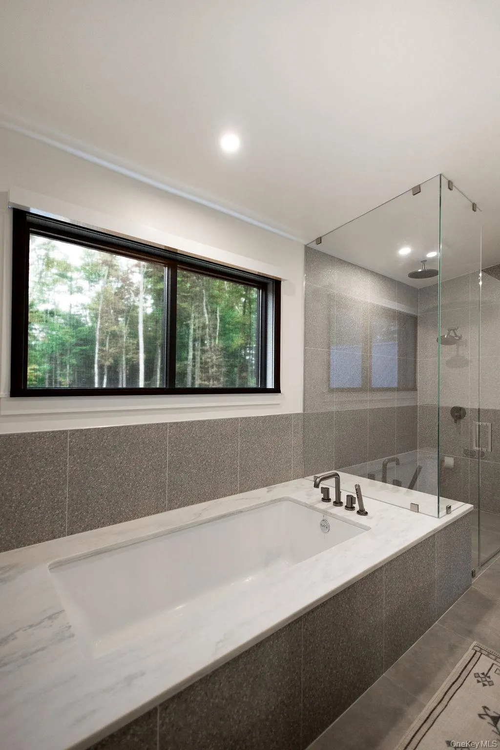 Bathroom with a bath and a stall shower Bathroom with a bath and a stall shower