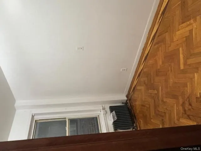 Empty room with baseboards and radiator heating unit Empty room with baseboards and radiator heating unit