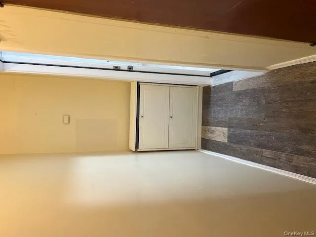 Hall with baseboards and dark wood-type flooring Hall with baseboards and dark wood-type flooring