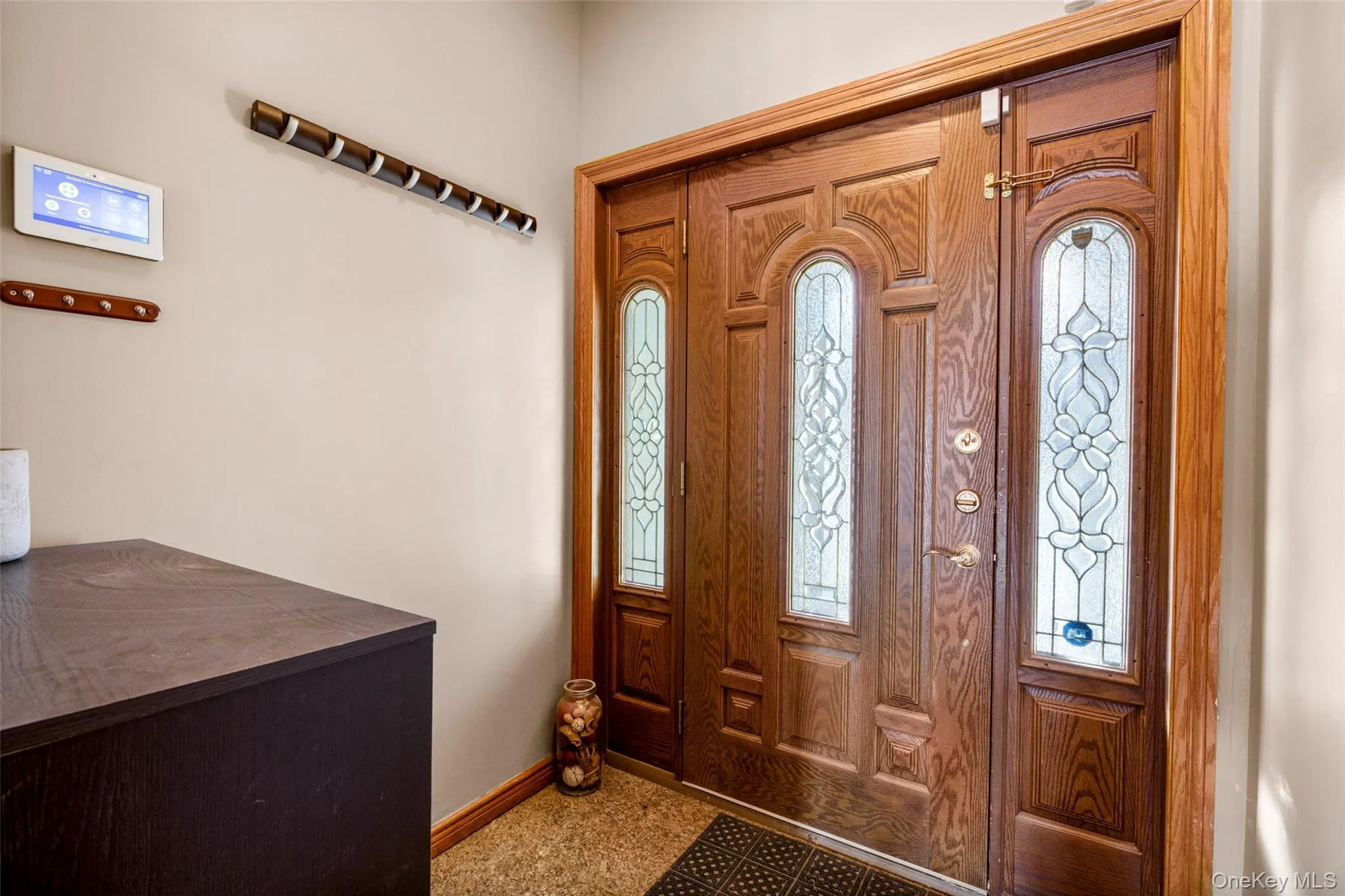 Foyer entrance featuring baseboards Foyer entrance featuring baseboards