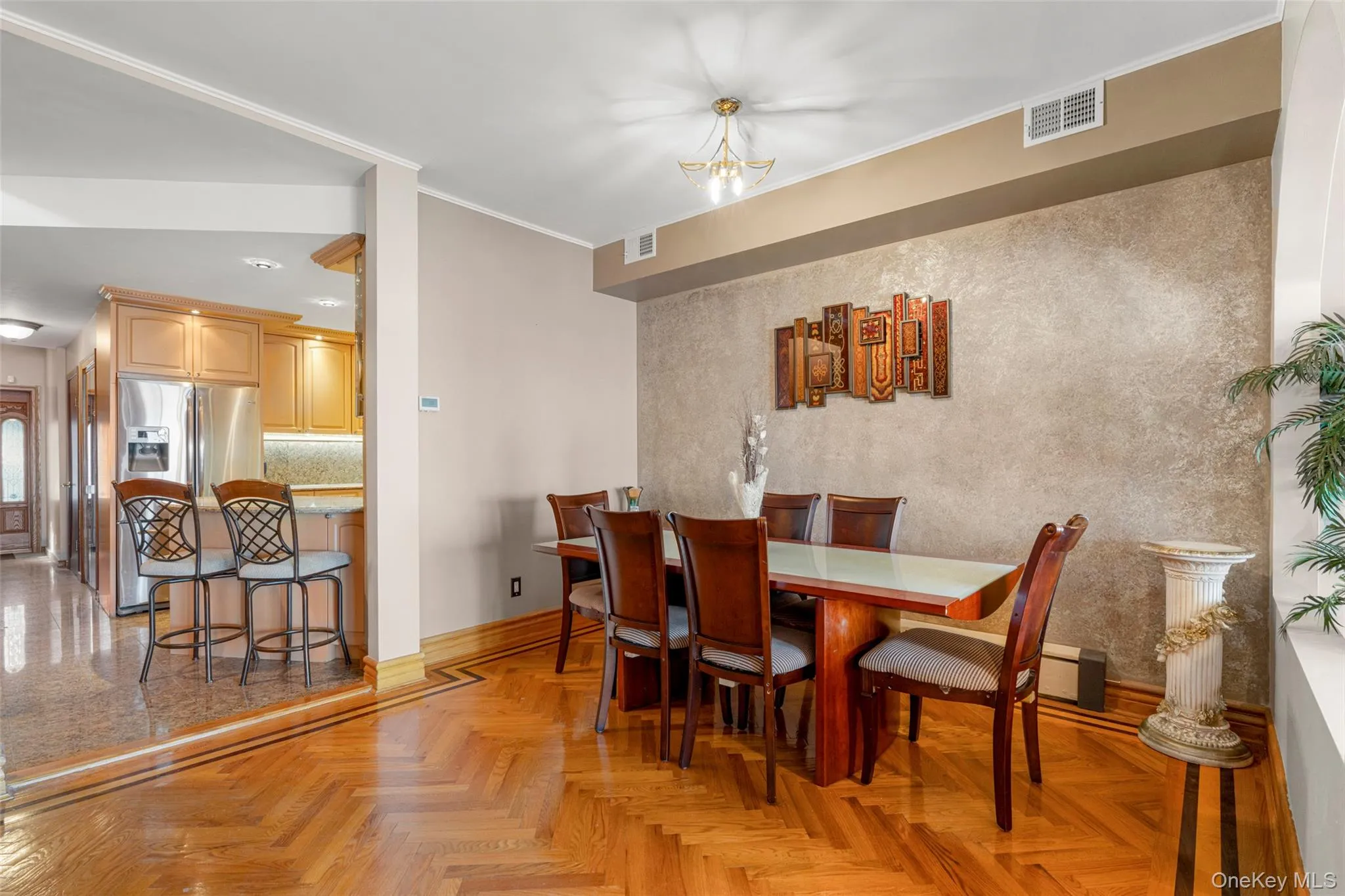 Dining area with ornamental molding and recessed lighting Dining area with ornamental molding and recessed lighting