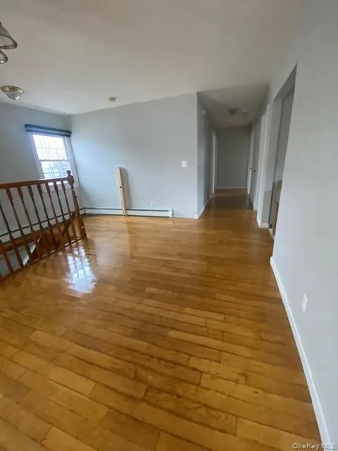 Spare room with light wood finished floors Spare room with light wood finished floors