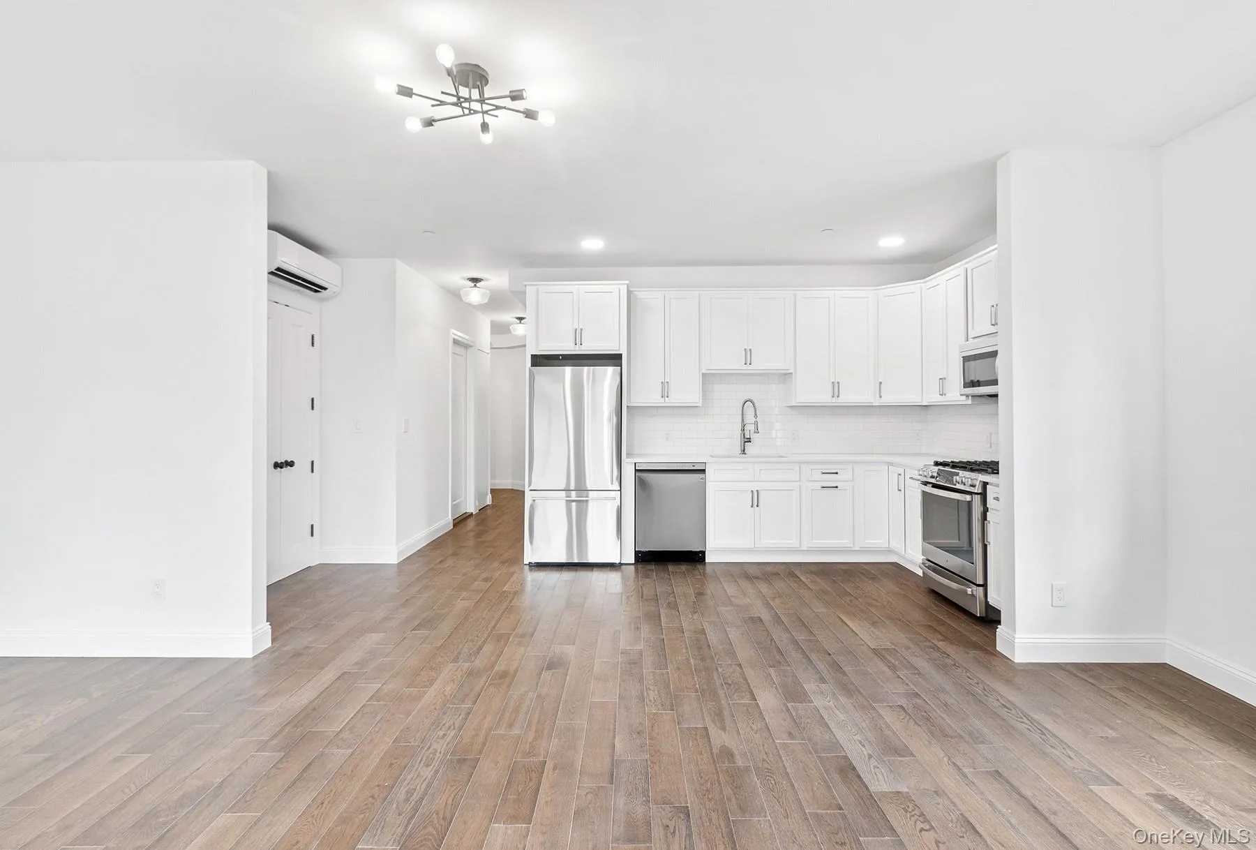 Photo taken in living room, facing the kitchen. Photo taken in living room, facing the kitchen.