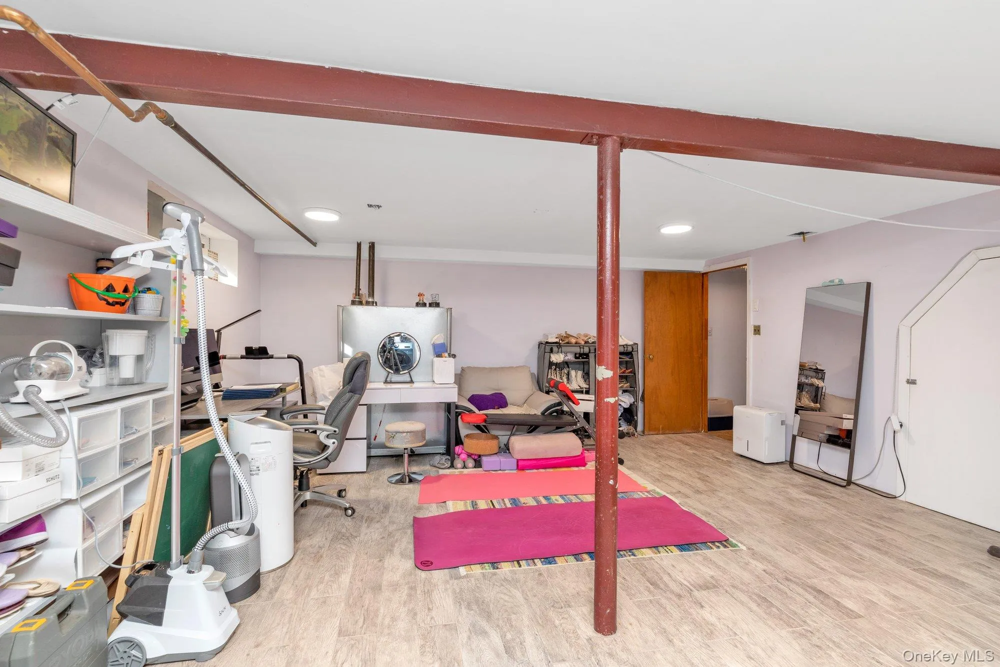 Exercise area featuring light wood-type flooring and recessed lighting Exercise area featuring light wood-type flooring and recessed lighting