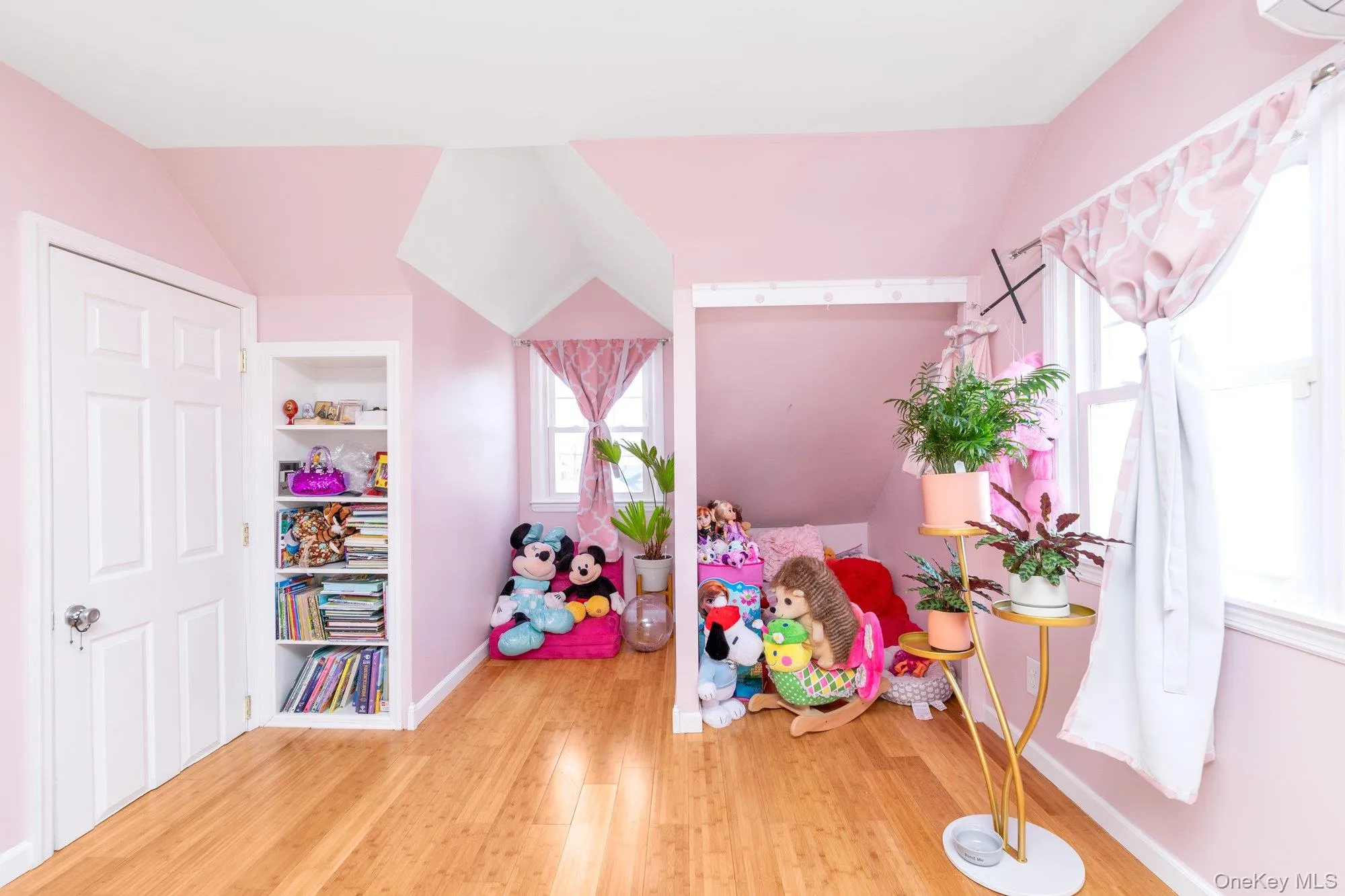 Playroom with light wood finished floors and lofted ceiling Playroom with light wood finished floors and lofted ceiling