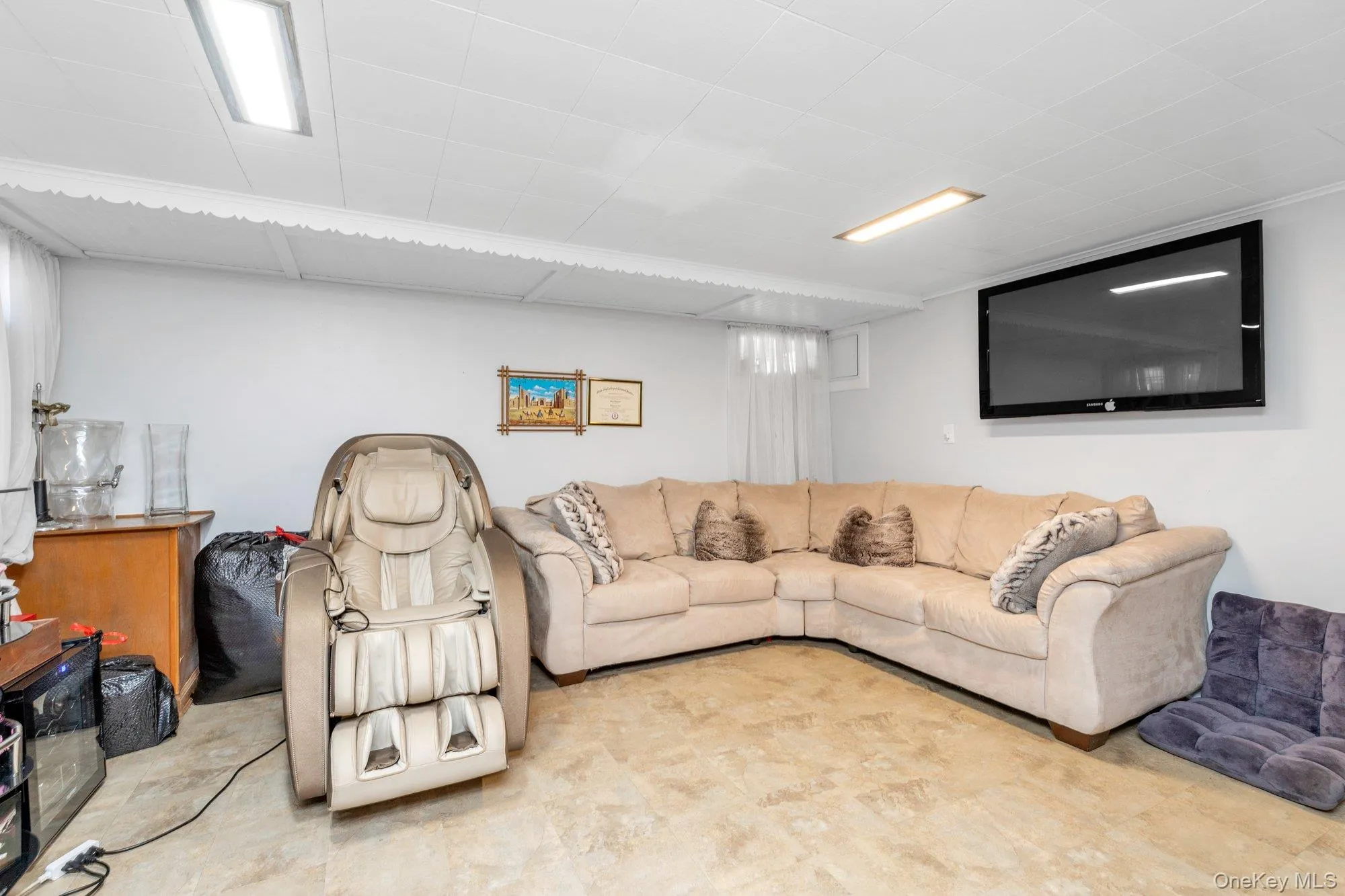 Living room with a paneled ceiling Living room with a paneled ceiling