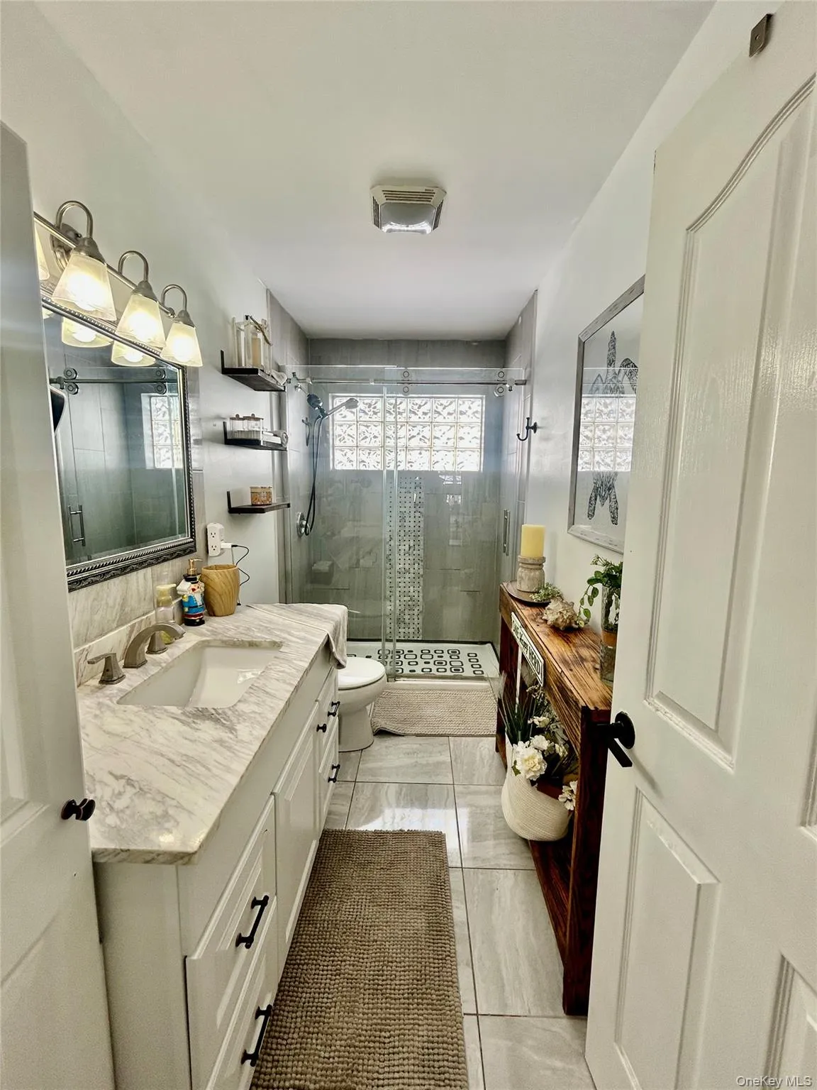 Full bath with vanity and a shower stall Full bath with vanity and a shower stall