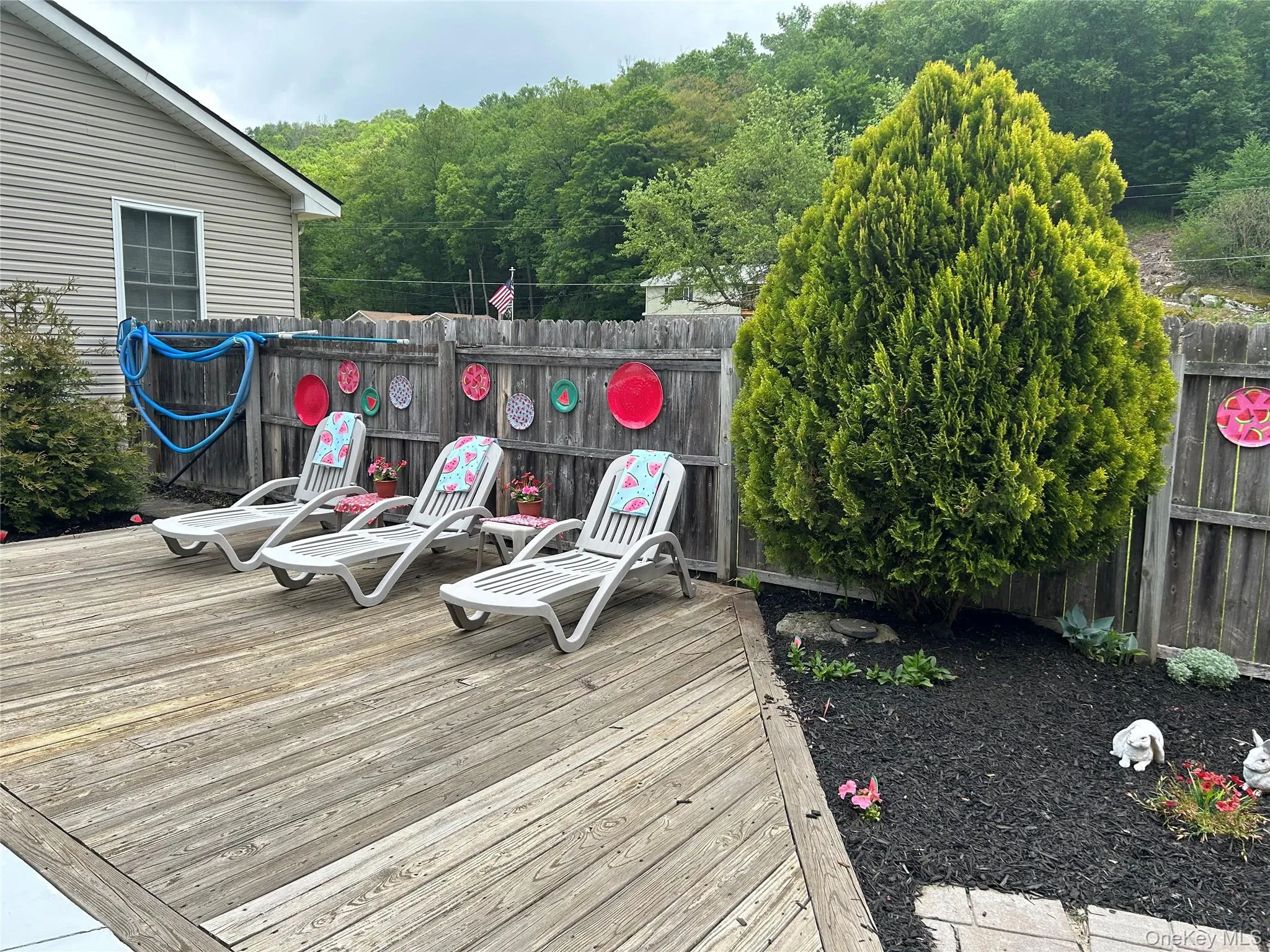 Wooden deck with a fenced backyard Wooden deck with a fenced backyard