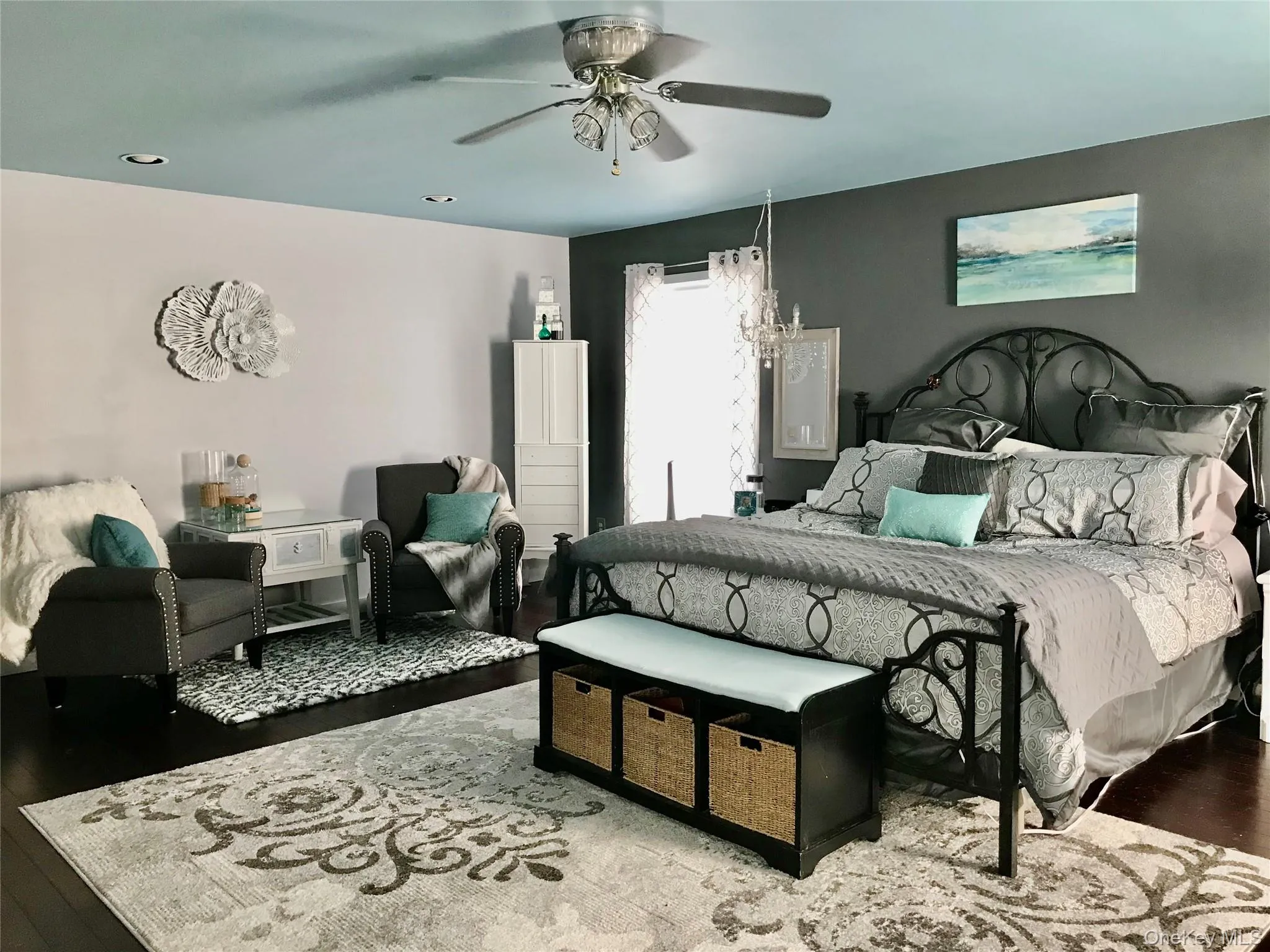 Bedroom with wood finished floors and a ceiling fan Bedroom with wood finished floors and a ceiling fan