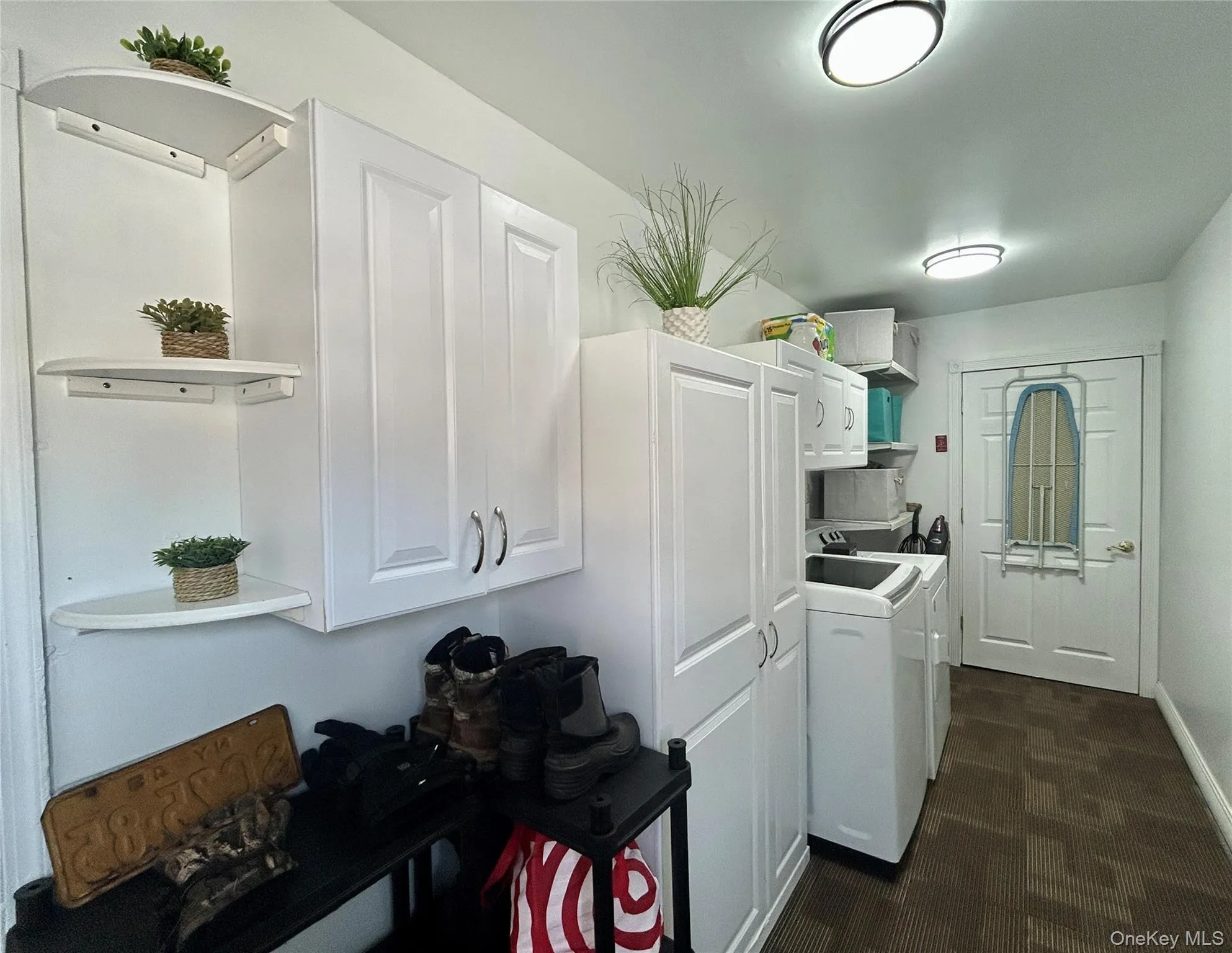 Laundry room featuring cabinet space Laundry room featuring cabinet space