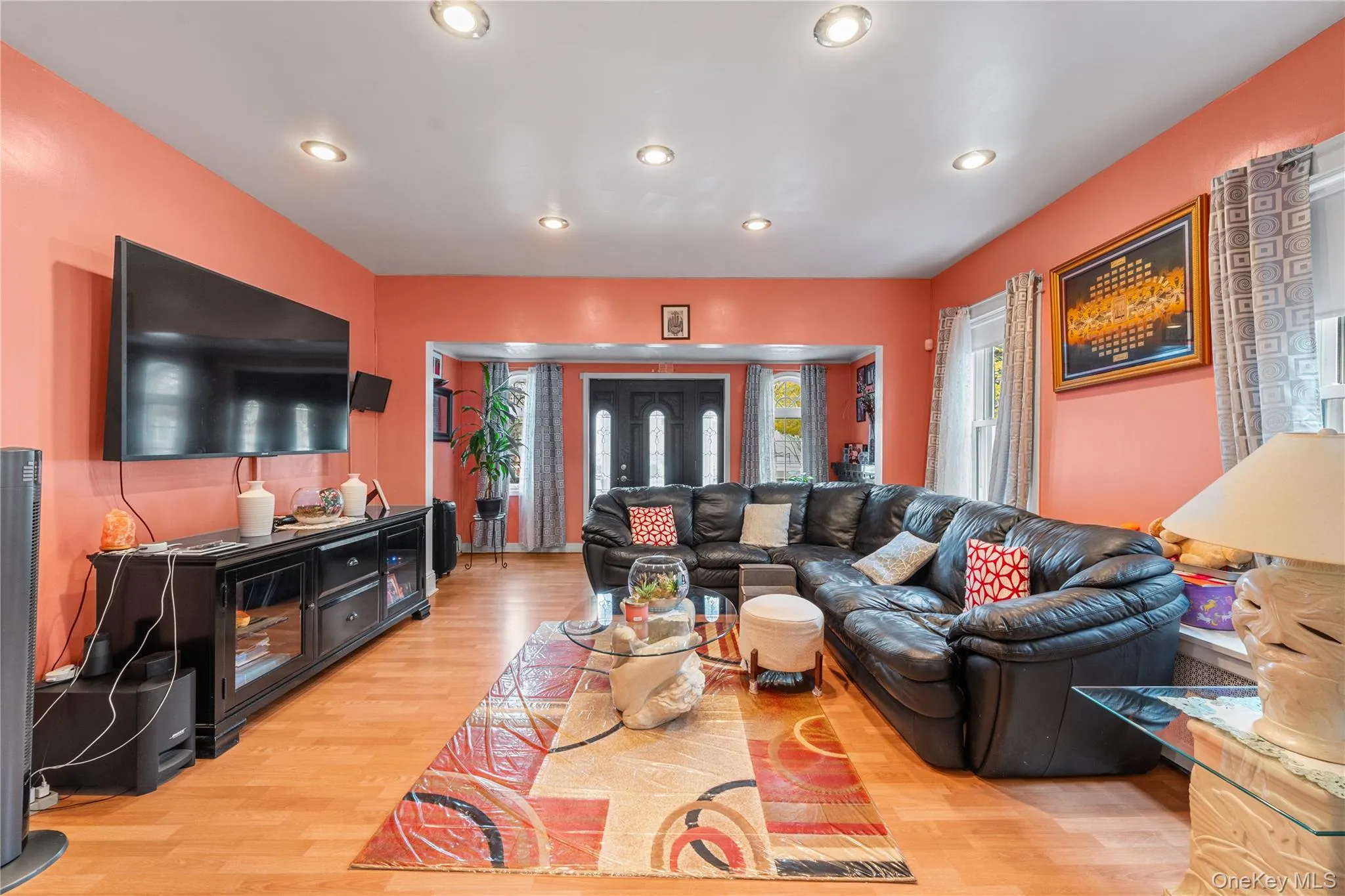 Living area with recessed lighting and light wood-style flooring Living area with recessed lighting and light wood-style flooring