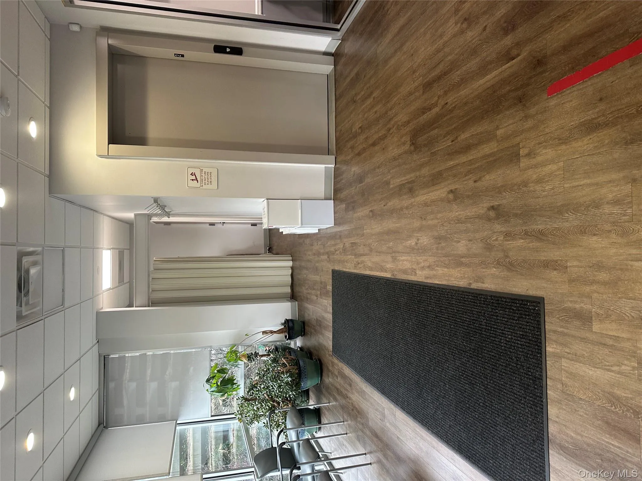 Community lobby with a paneled ceiling and recessed lighting Community lobby with a paneled ceiling and recessed lighting